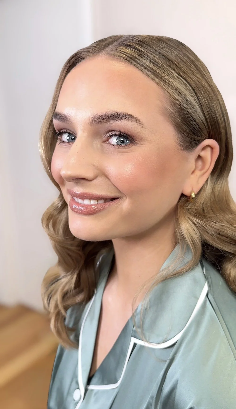 Bridesmaid with soft glam makeup and waves in Adelaide