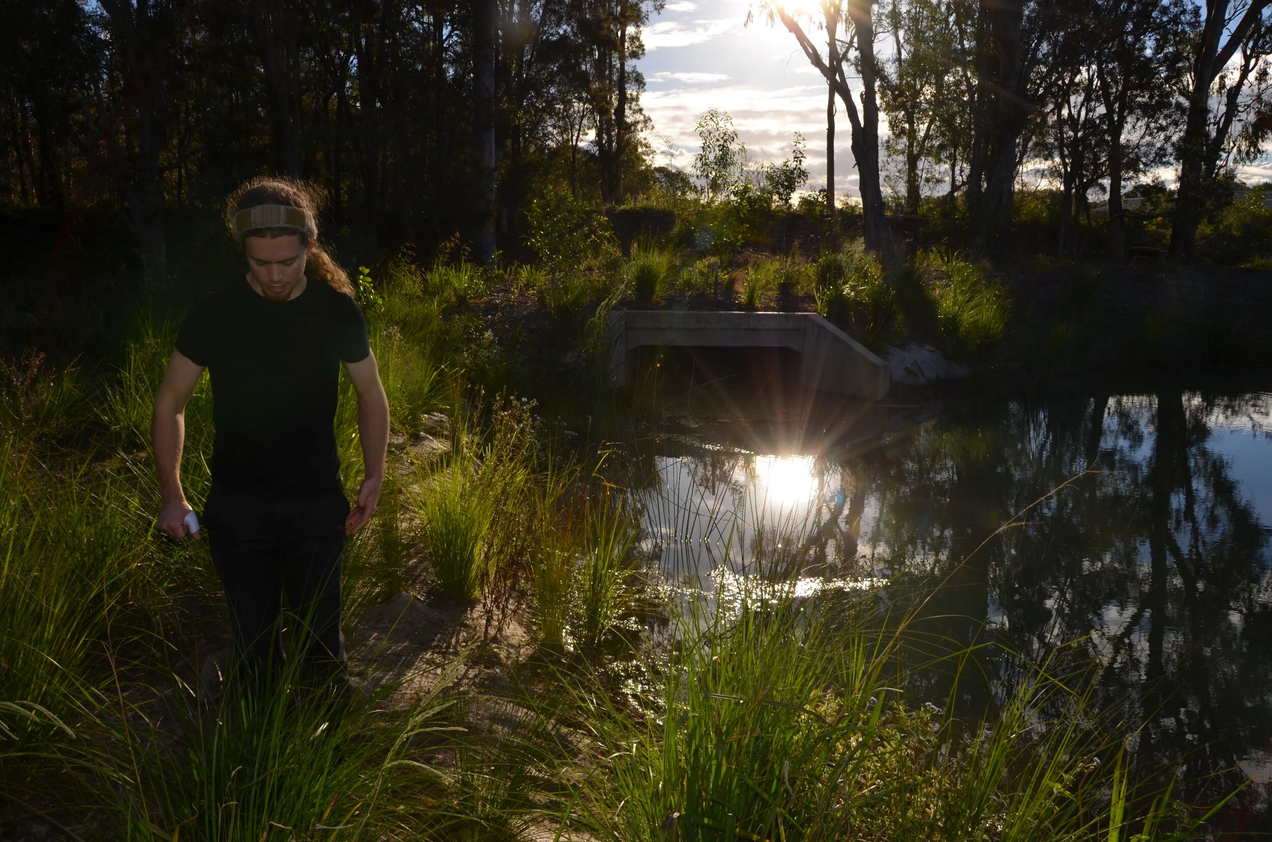 Coach Jack Mullaly near a sediment basin