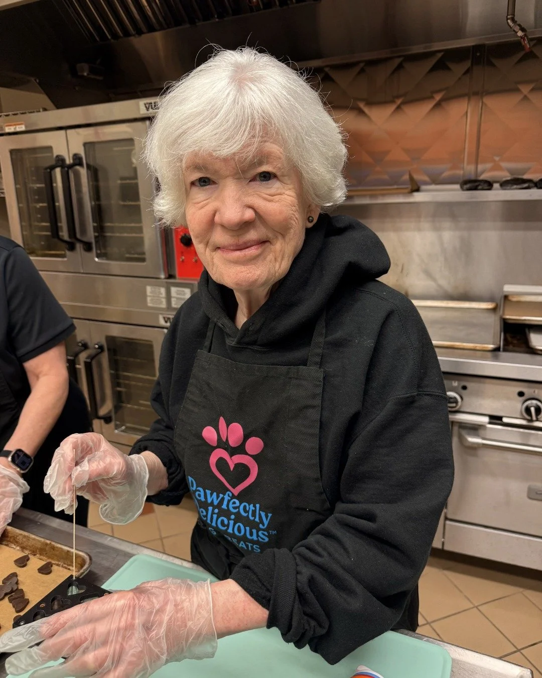 Meet Peg! Peg is one of our newest volunteers and here's what she has to say about working with our team, "I&rsquo;m so proud to be a Pawfectly Delicious volunteer because of the joy-filled and hard-working employees on our baking and packing te