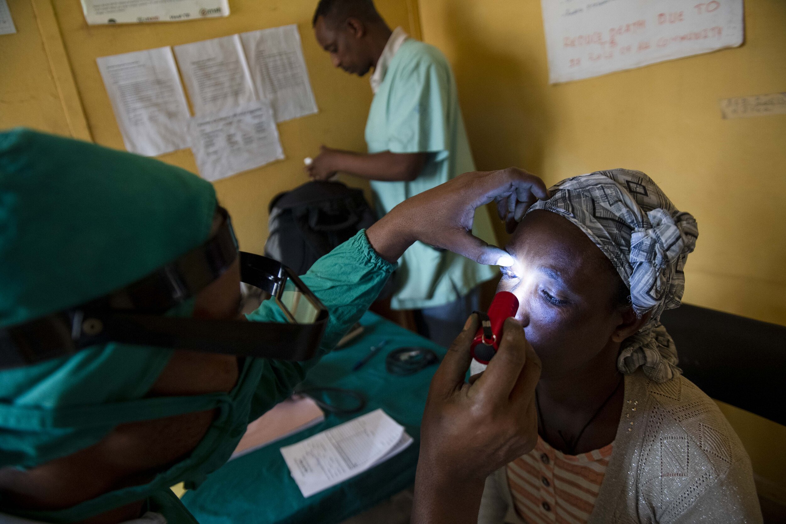  A doctor checks Asnaku Tufa’s eyes for Trachomatous Trichiasis (TT) during a free screening at the Dire Primary Health Care Unit. She tested positive for the disease. 