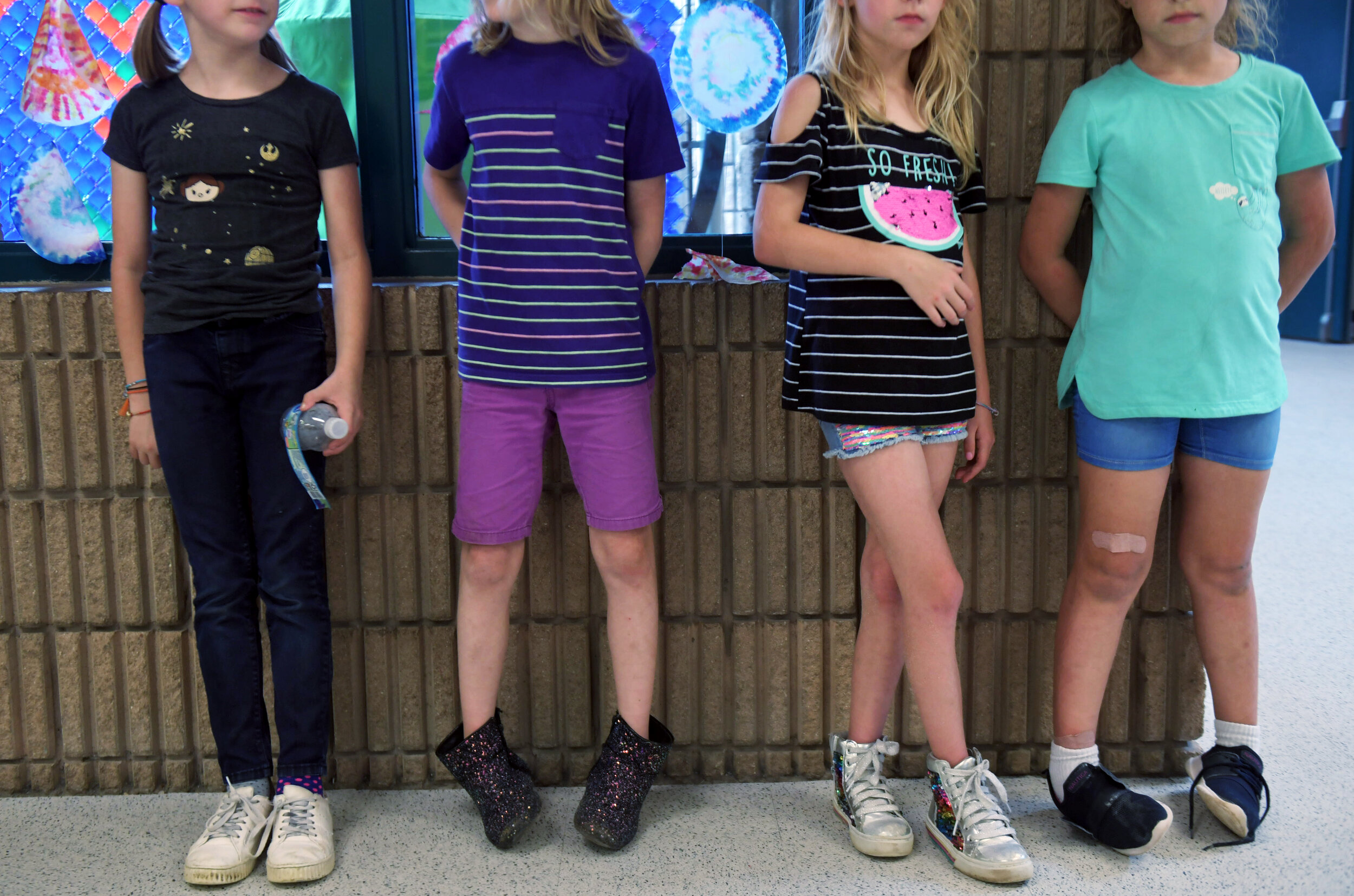  Keegan, a gender creative child, then 8, middle left, stands with his 3rd grade classmates in between classes at his 3rd grade elementary school in Austin, Texas, U.S., May 3, 2019.   His teacher says he is a leader in his class, and has grown a lot