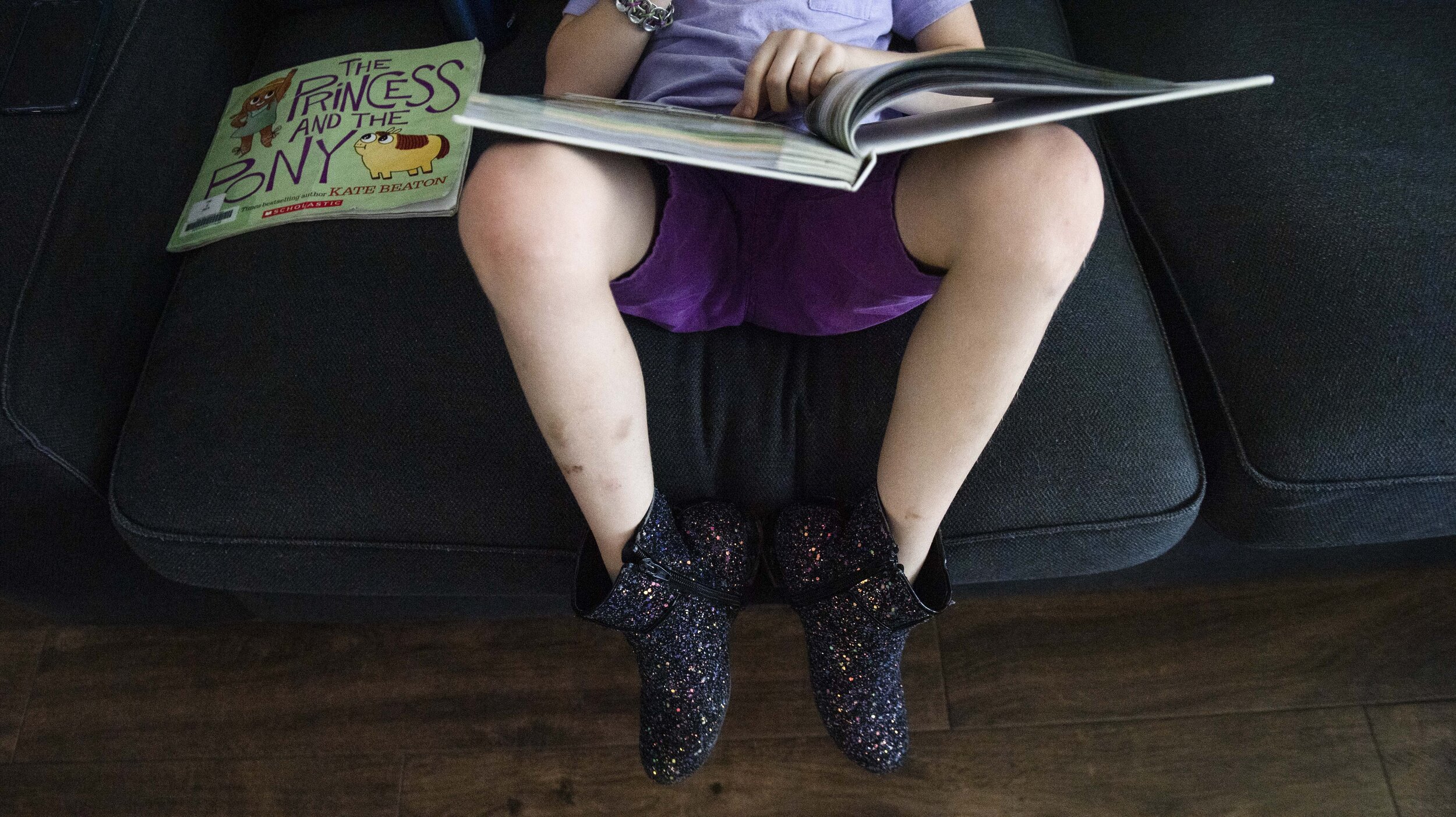  Keegan, a gender creative child, then 8, reads at home in Austin, Texas, U.S., April 25, 2019.  Keegan's favorite book is 'Prince + The Dressmaker'. His parents have also included LGBTQ children's literature to his reading list.  The objective, they