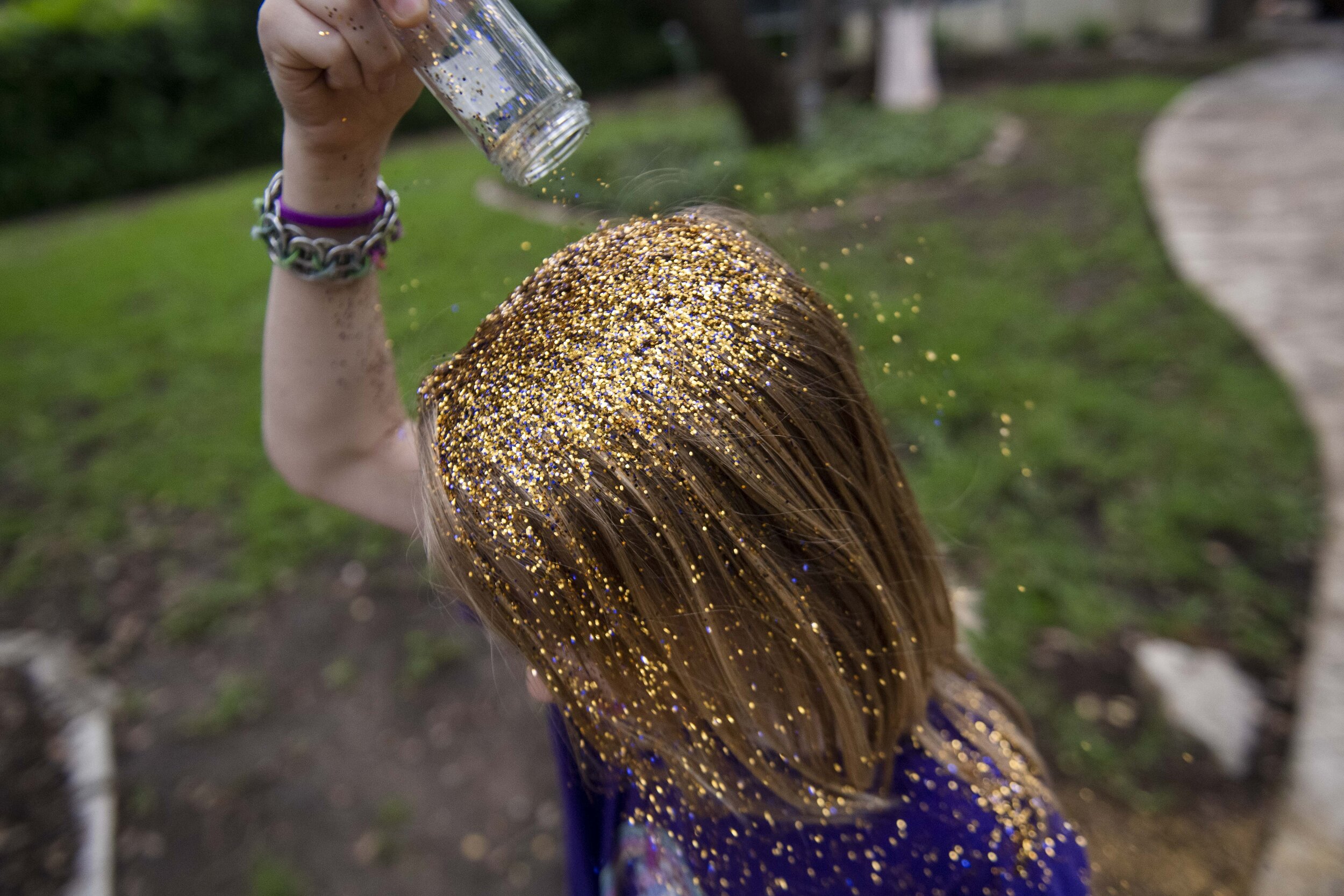  Keegan, a gender creative child, 9, pours glitter on his head during his 9th birthday party at his home in Austin, Texas, U.S., May 10, 2019.  The glitter party was inspired by a Queer Eye episode.  Keegan's family says he was motivated to try drag 