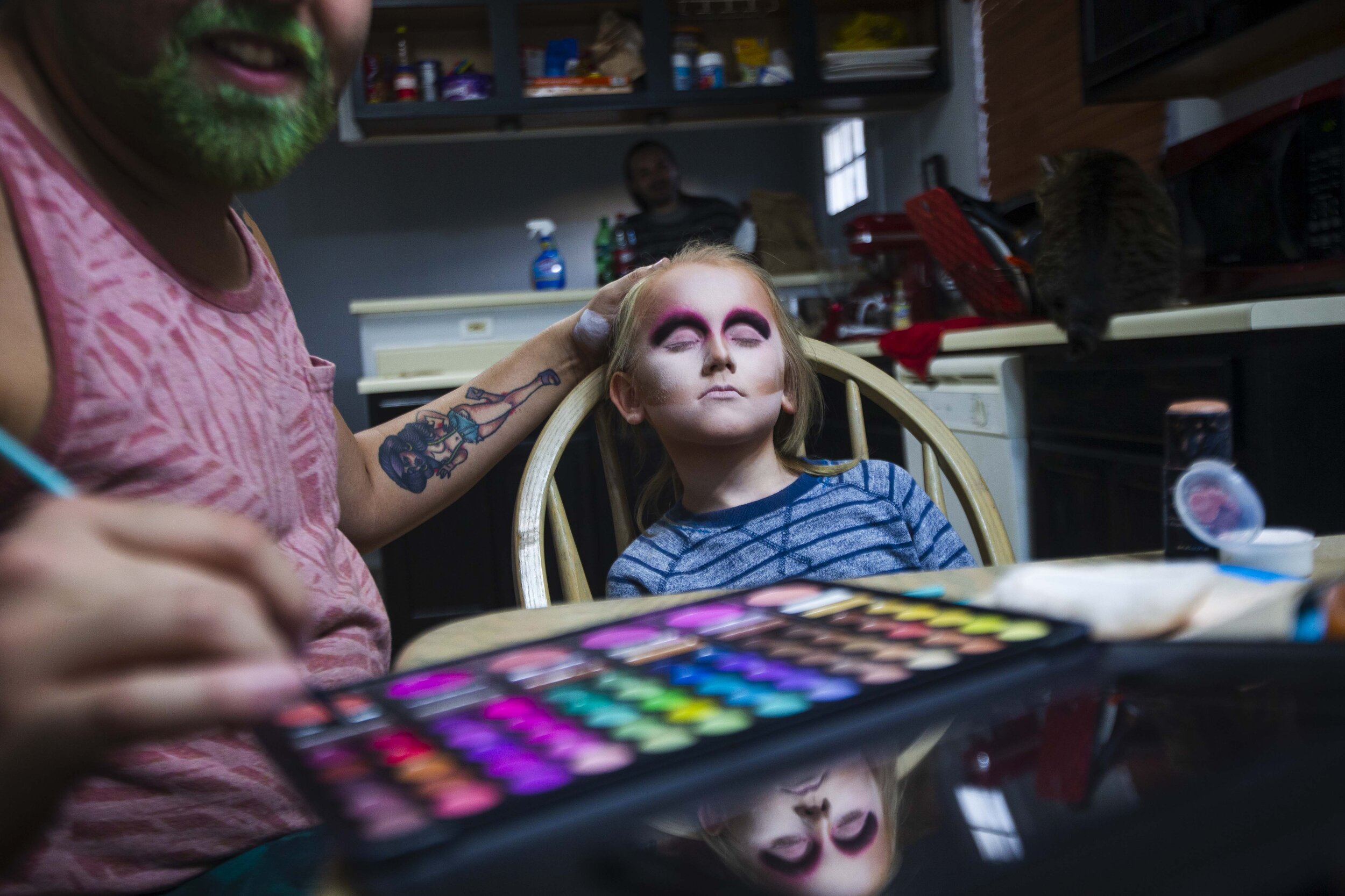  Robby, a drag queen, then 25, left, applies makeup, as his husband, Alex, then 26, at rear, looks on during a drag lesson for Keegan, a gender creative child, then 8, right, at their home in Austin, Texas, U.S., Nov. 15, 2018.    As the years have p