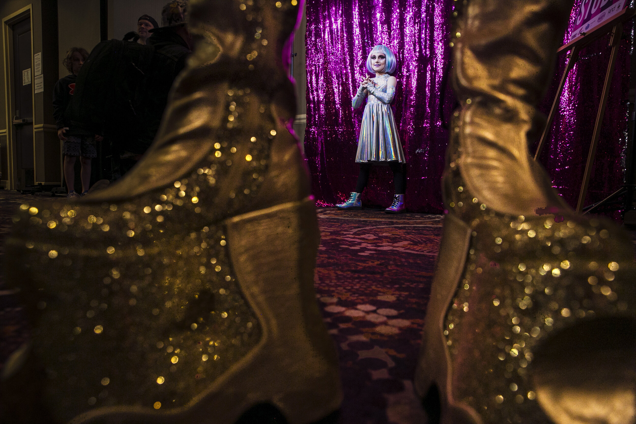  Keegan, a gender creative child, drag name KweenKeekee, then 8, is framed by the shoes of another performer while posing for the camera after completing his first drag performance during the Austin International Drag Fest 2018 in Austin, Texas, U.S.