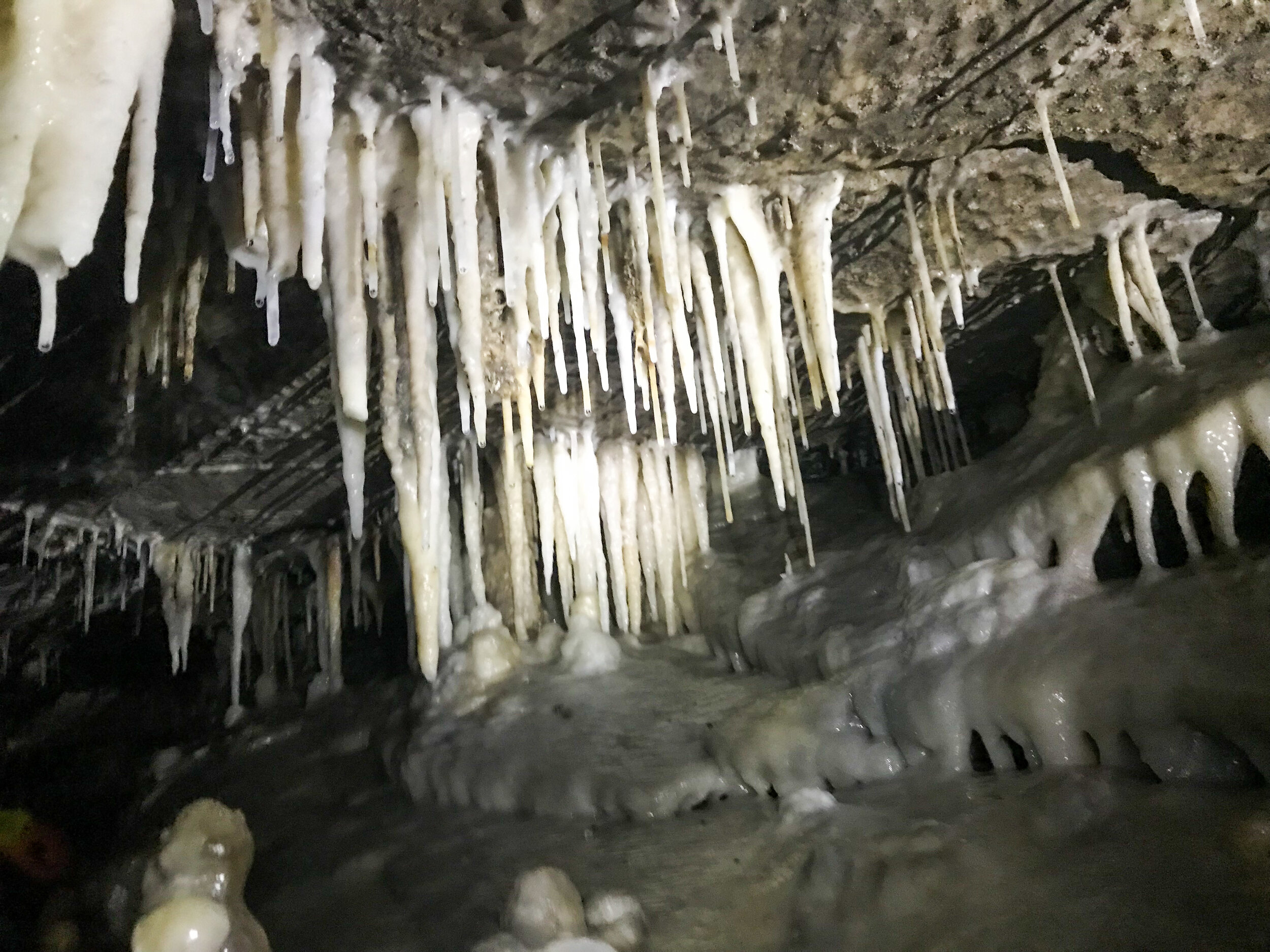 Caving (spelunking) in Ease Gill caverns, the longest and most complex cave system in the UK.