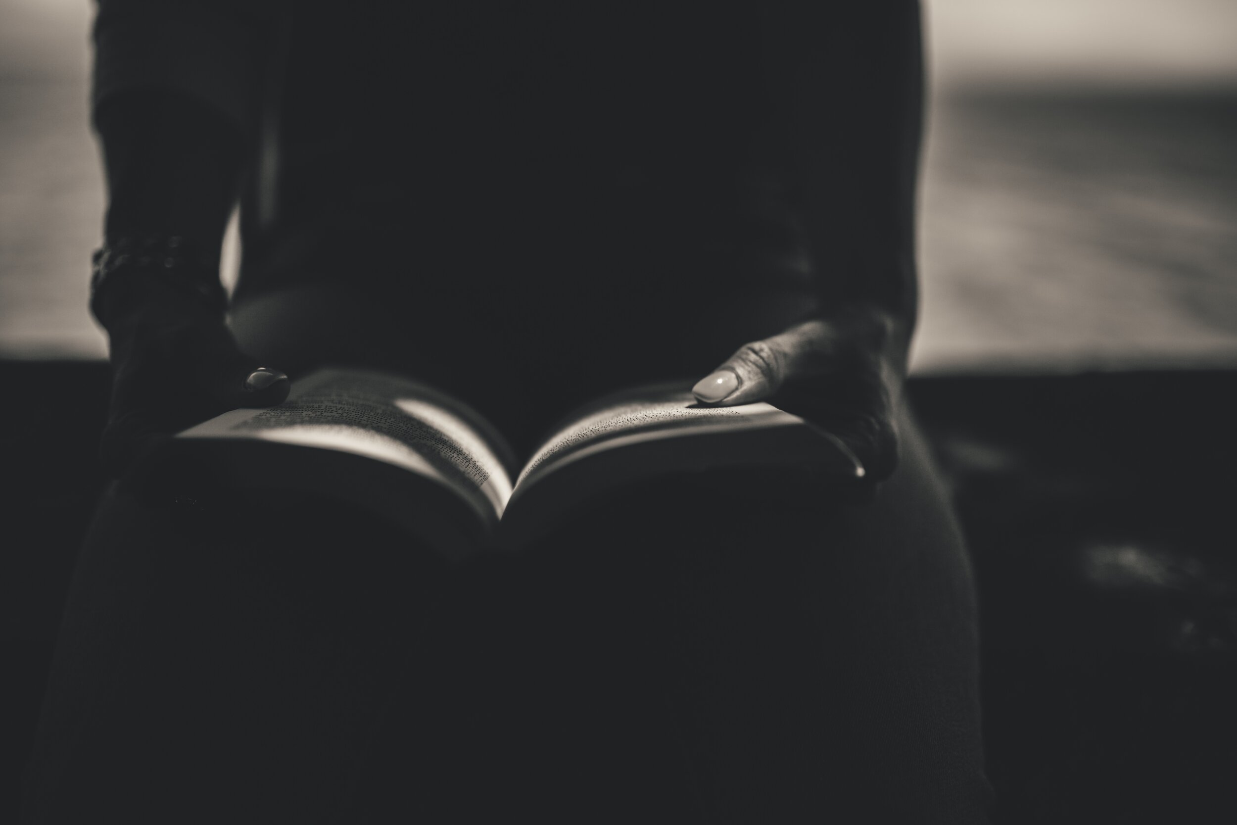 negative-space-black-white-reading-book-woman.jpg