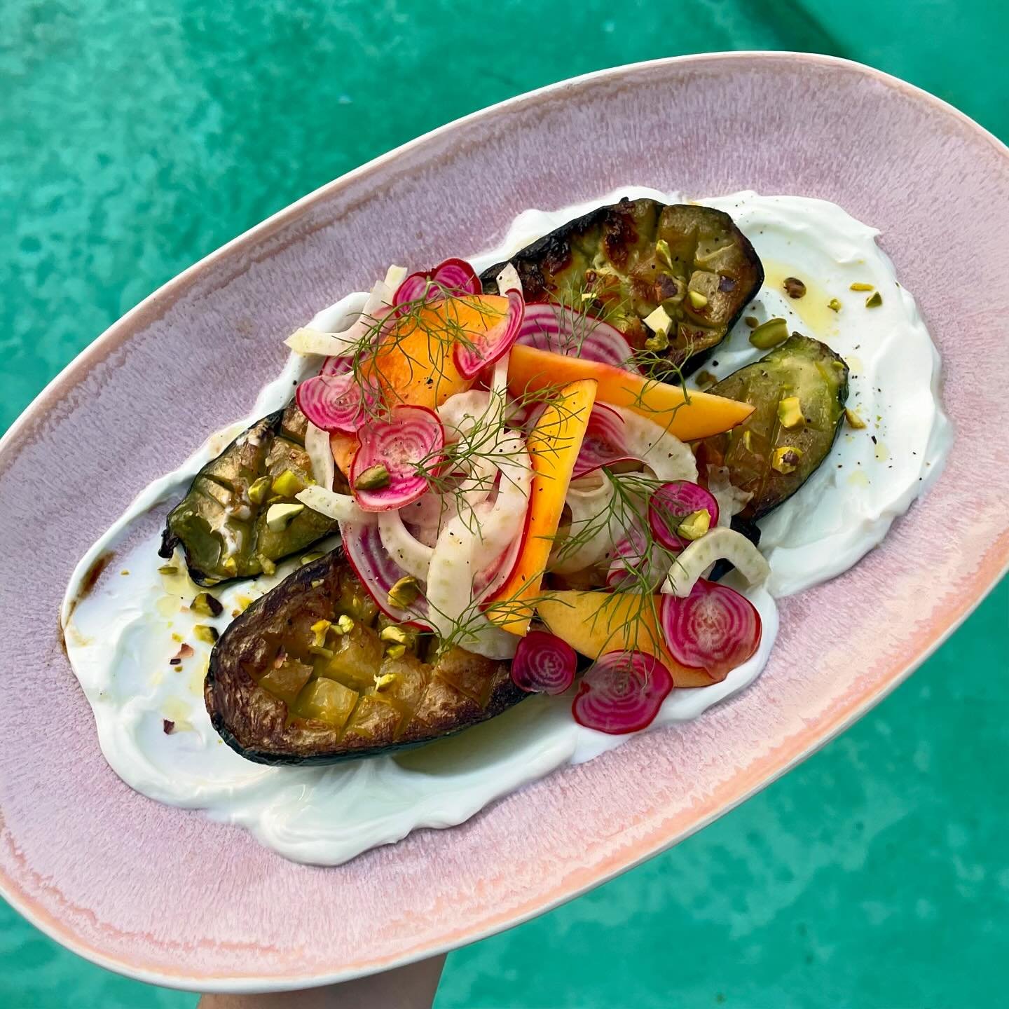 my dinner! zucchini on skyr with goat cheese and pistachios topped with a little nectarine fennel beet salad! boy do i love vegetables!!