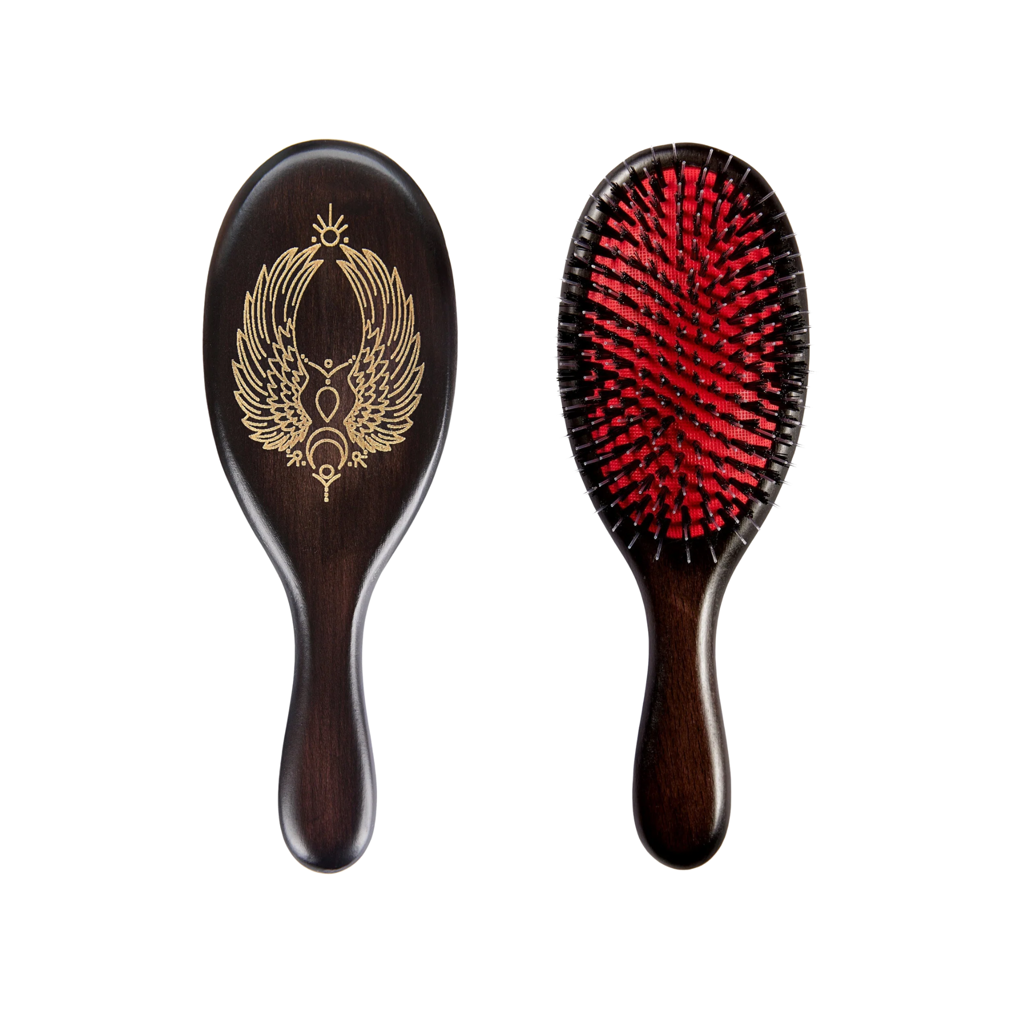 Two wooden hairbrushes, one with a decorative winged symbol engraved on the back and the other with red bristles.
