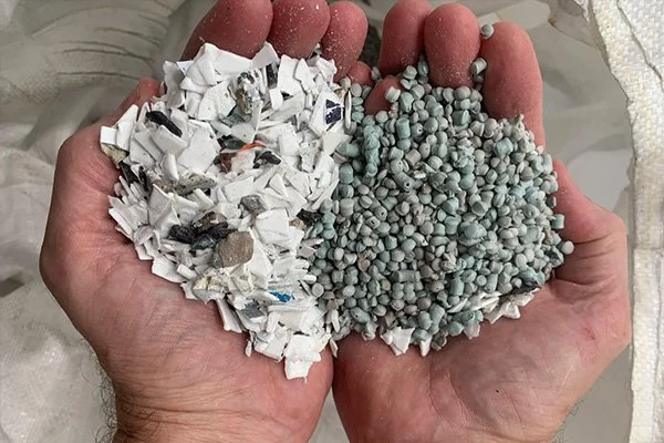 hands holding plastic granules