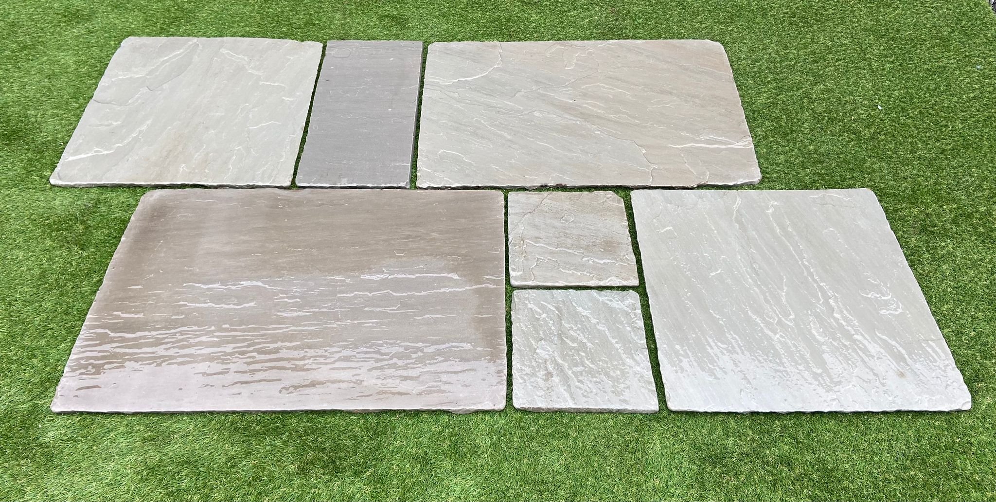 Image of Shanlieve Stones Grey Limestone laid on grass in their paving show area in Newry Count Down 