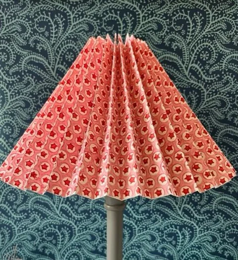 Accordion lampshades - made easy! 
Ever thought about making an accordion pleated shade?
1. Cut a length of stick-it and adhere your chosen paper or fabric (see below for suppliers)
2. Decide on widths of pleats - I like 2cms, so score along the pane