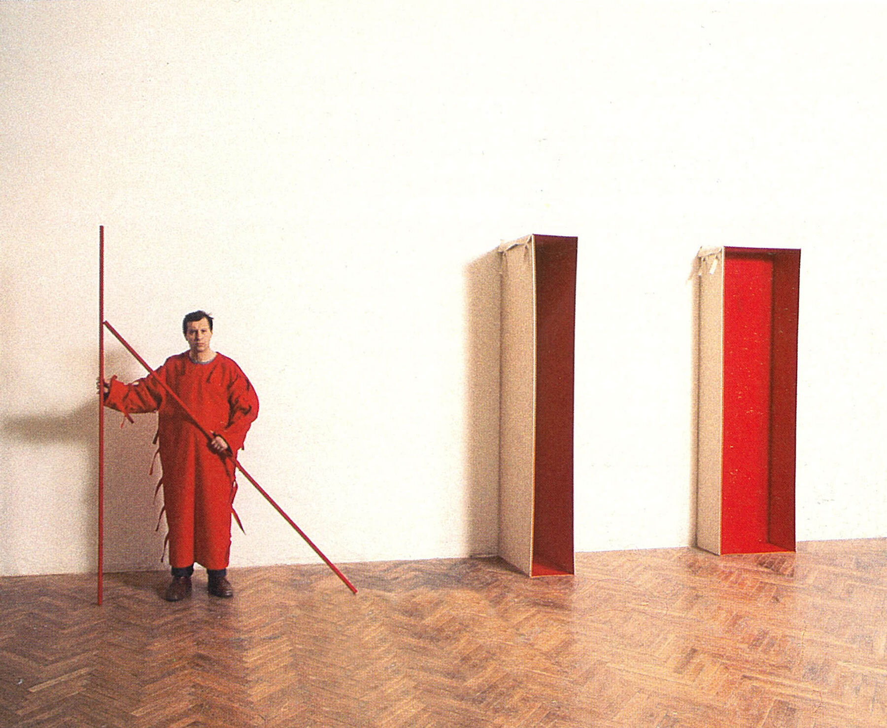   Franz Erhard Walther activating Der Genauigkeit wegen nur lose angelehnt, Wall Formation series, 1980-83, canvas fabric, wood, unique, dimensions variables. Image from the catalog 'Franz Erhard Walther - Ich bin die Skulptur', published on the occa