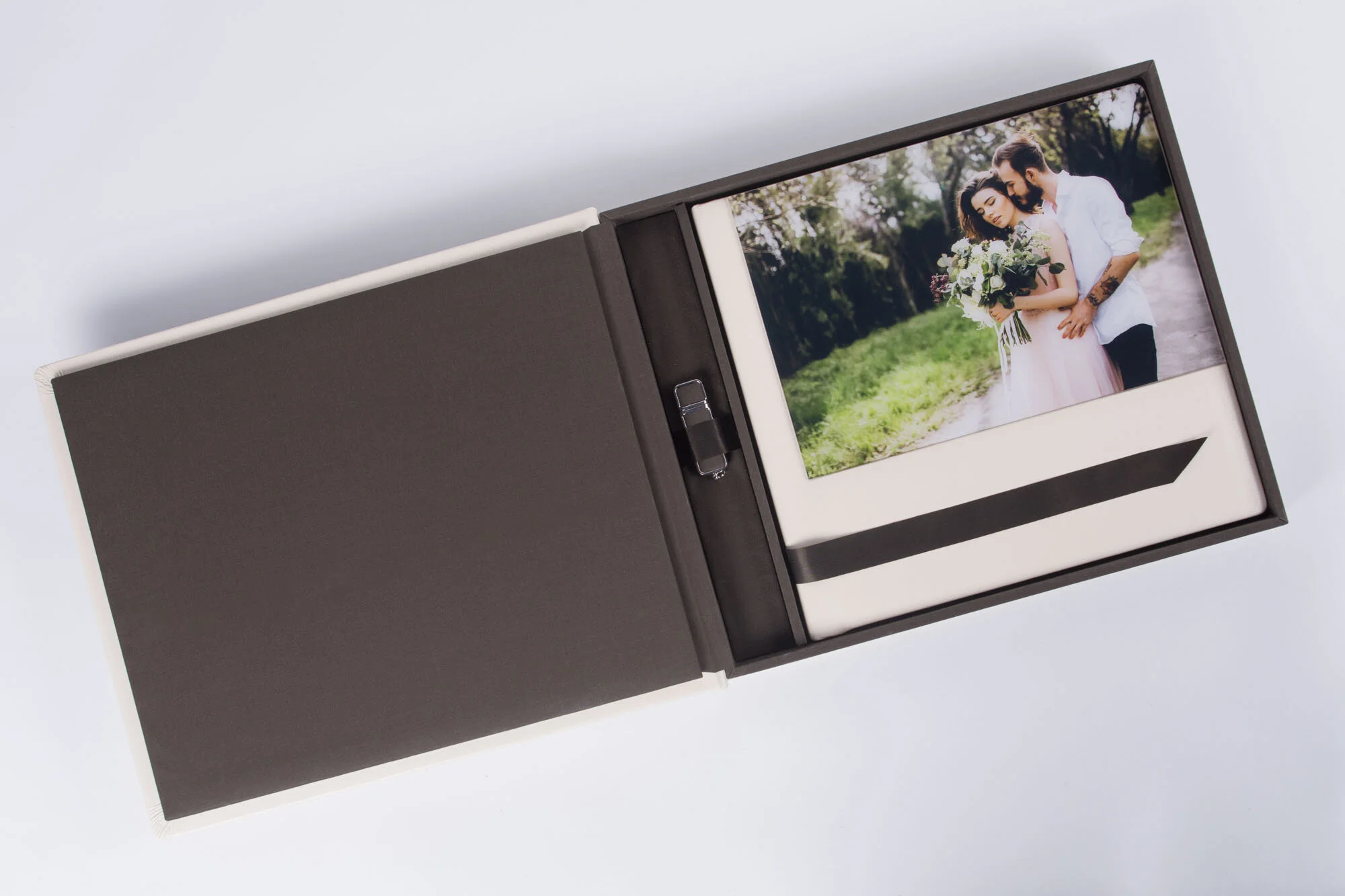 The Complete DreamBook 4K is a 3-in-one product consisting of a DreamBook, matching box and USB (optional). Printed on the Canon DreamLabo 5000 with inkjet technology, it offers incredible image resolution creating an unbelievably realistic story. Combined with a quality, handmade hardcover and layflat spreads make it an ideal product that will satisfy even your most demanding customers. The DreamBook's cover options are what define each collection. Personalise the interior with one of three paper types: Gloss (250g), Lustre (250g) or Satin (170g). Make your selection from three exquisite collections and see what the DreamBook 4K is all about. Each Book and Box have identical covers and the USB is coated in the same textile as the interior of the box.