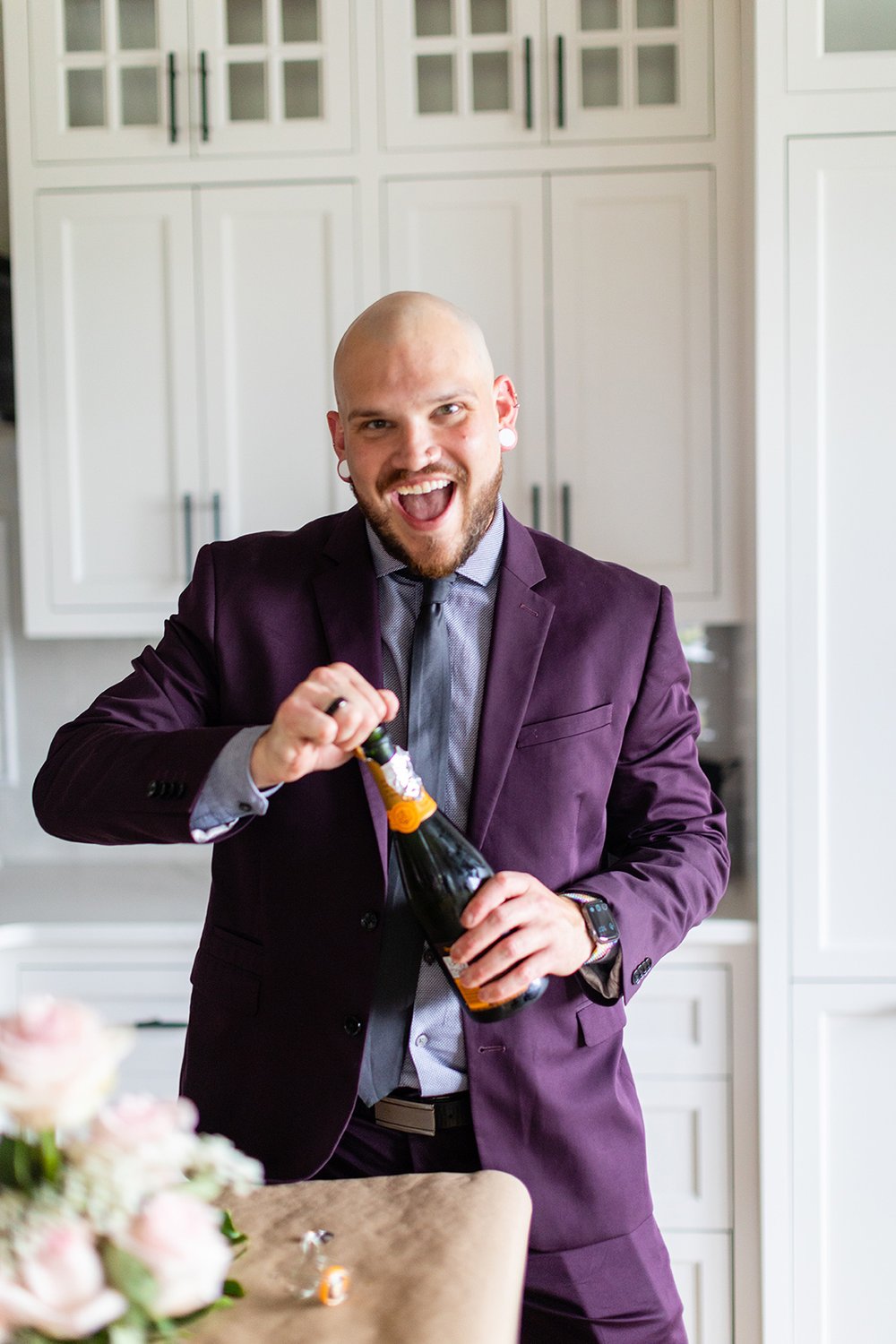 purple_suit_champagne_popping.jpg