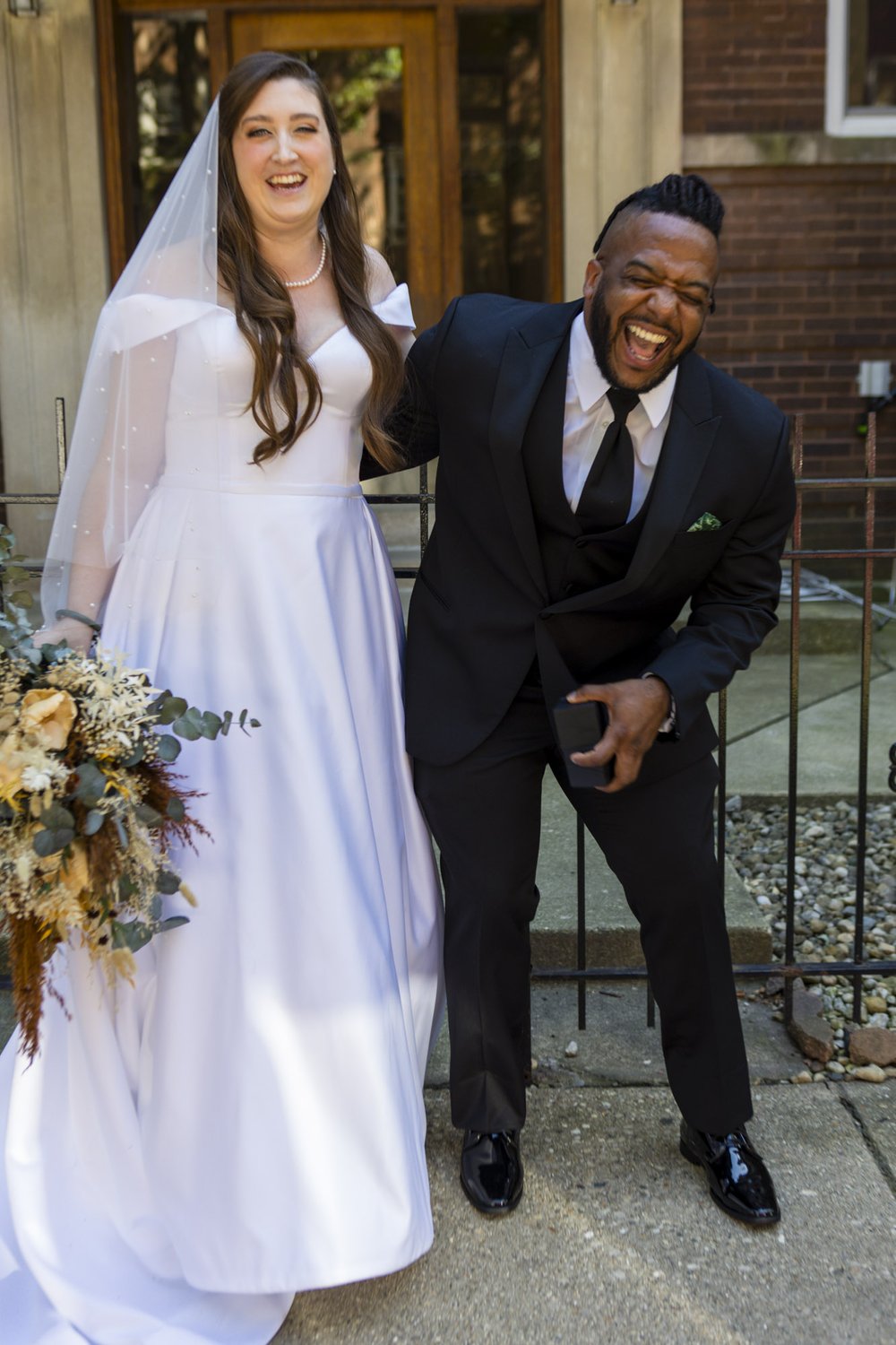 Chicago_Firehouse_bride_and_ringbearer_laughing.jpg