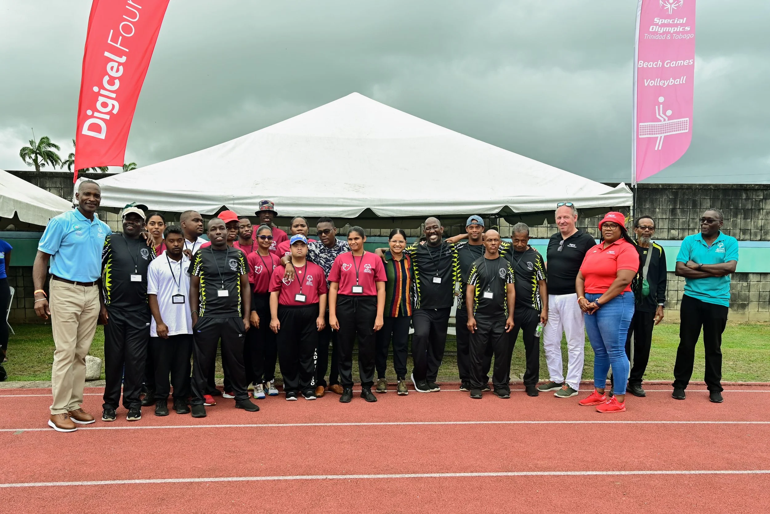 Minister of Sport and Youth Affairs, the Honourable Phillip Watts, and Minister of Social Development and Family Services, the Honourable Vandana Mohit (centre), join Digicel Trinidad and Tobago CEO Pieter Verkade and Digicel Foundation Director LaToya Gopaul (fourth and third from right) for a photo with Special Olympics Trinidad and Tobago Chairman David Benjamin, along with athletes and coaches, at the opening of the Special Olympics National Games held at the Mannie Ramjohn Stadium on May 10th.