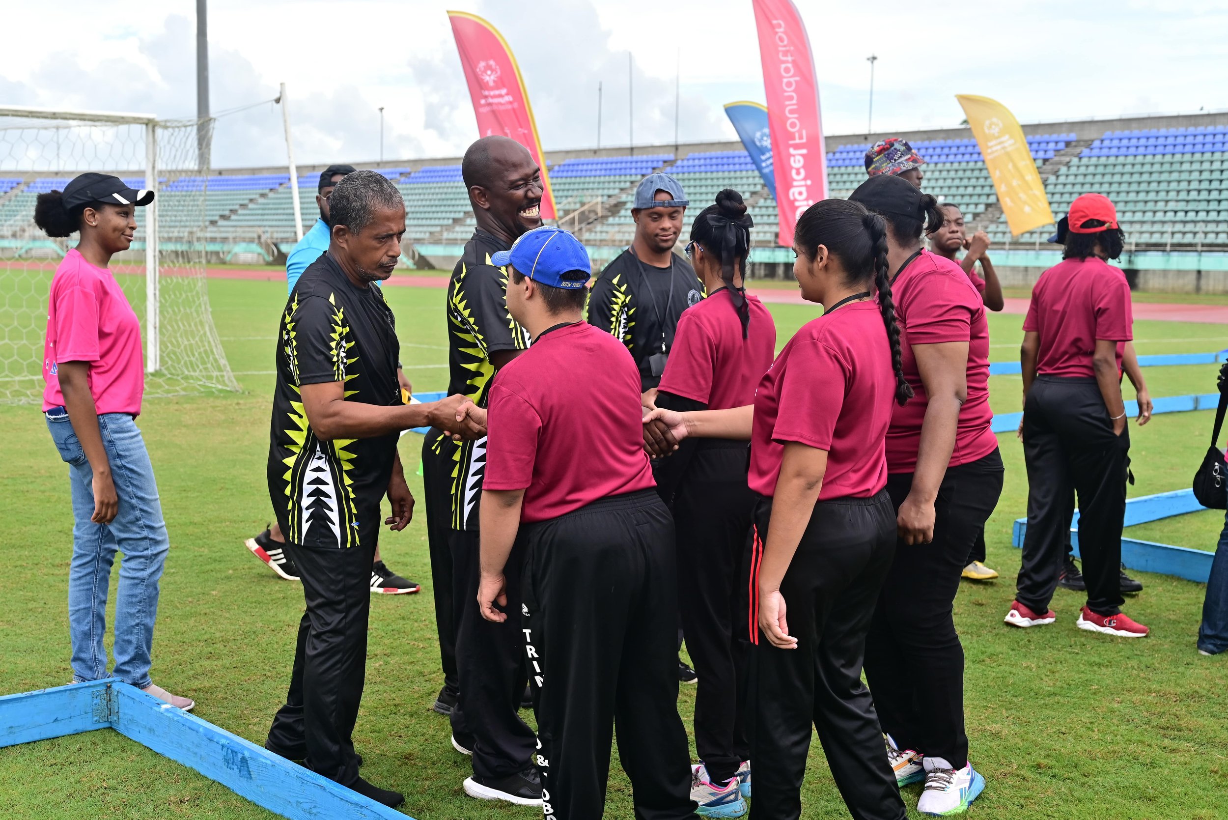 Fierce or friendly competition? Athletes shake hands after facing off in Bocce at the Special Olympics National Games on 10th May at the Mannie Ramjohn Stadium.