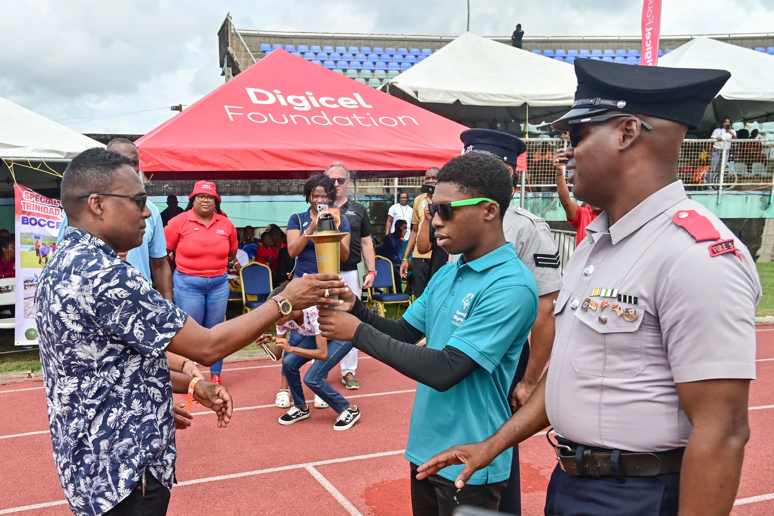 The Special Olympics National Games officially open with the passing of the Olympic torch to Minister of Sport and Youth Affairs, the Honourable Phillip Watts on 10th May at the Mannie Ramjohn Stadium, Marabella.