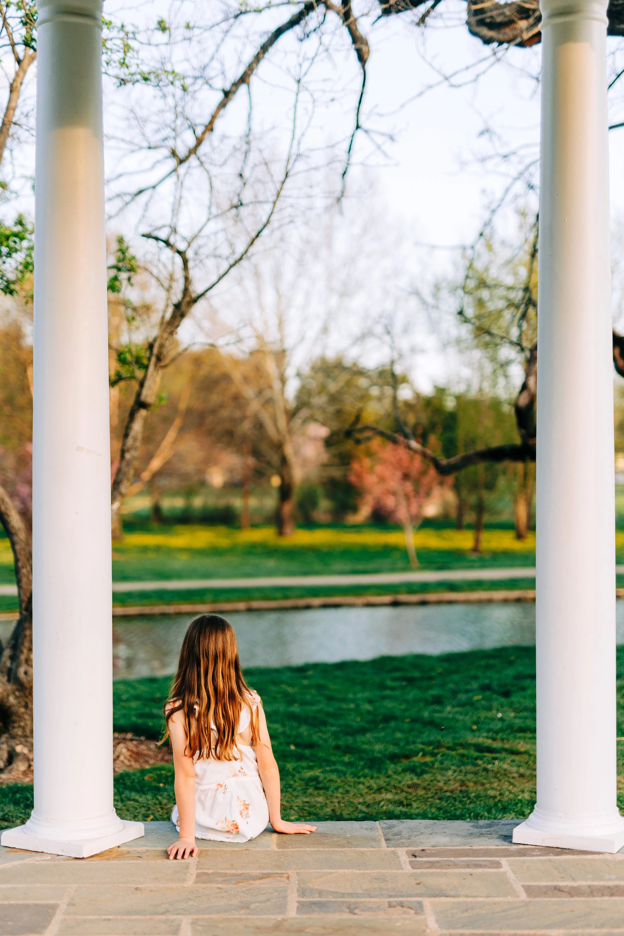 Child sitting in the gazebo at the Rose Gardens in Allentown