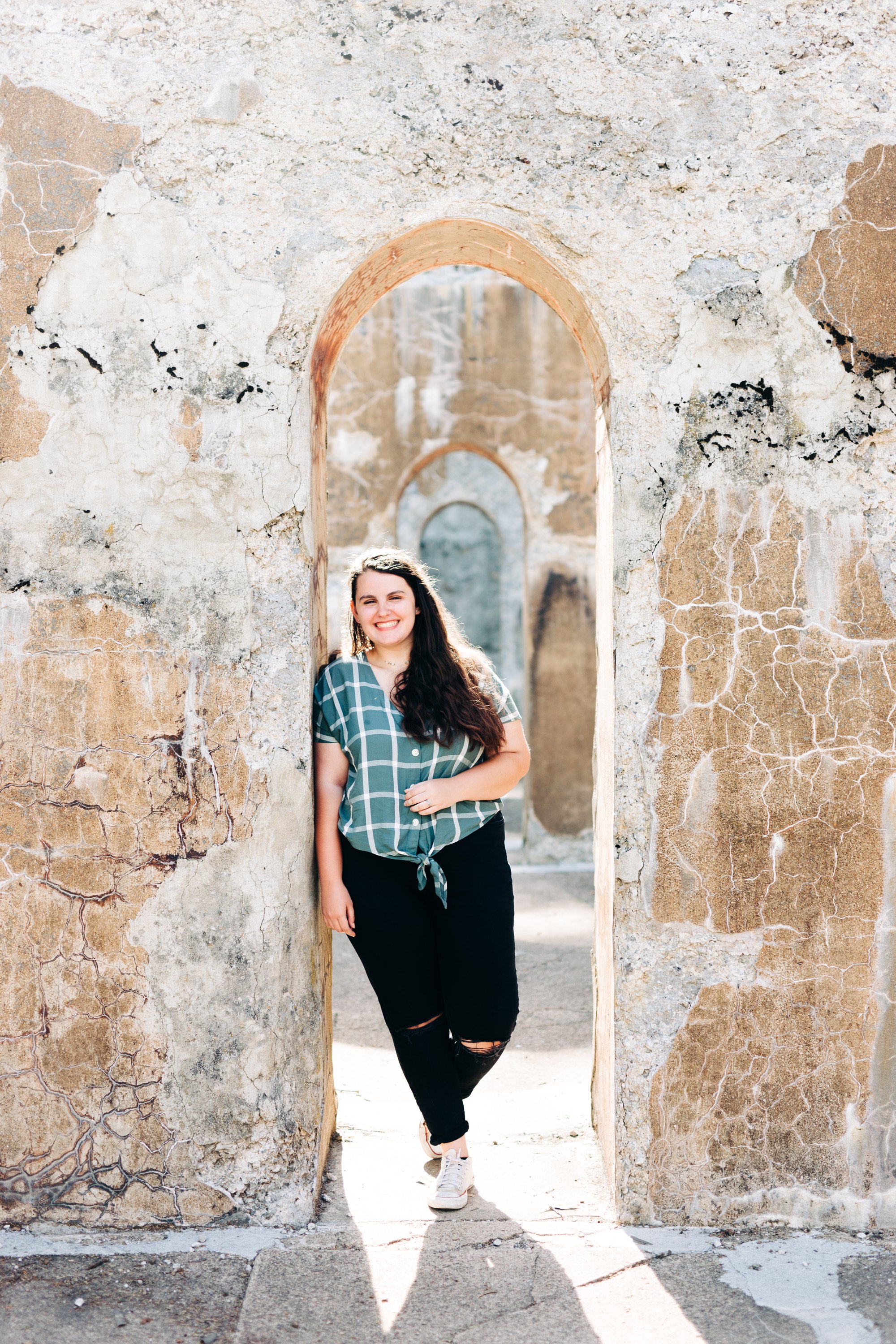 Woman posing for portrait at Lock Ridge Park arch