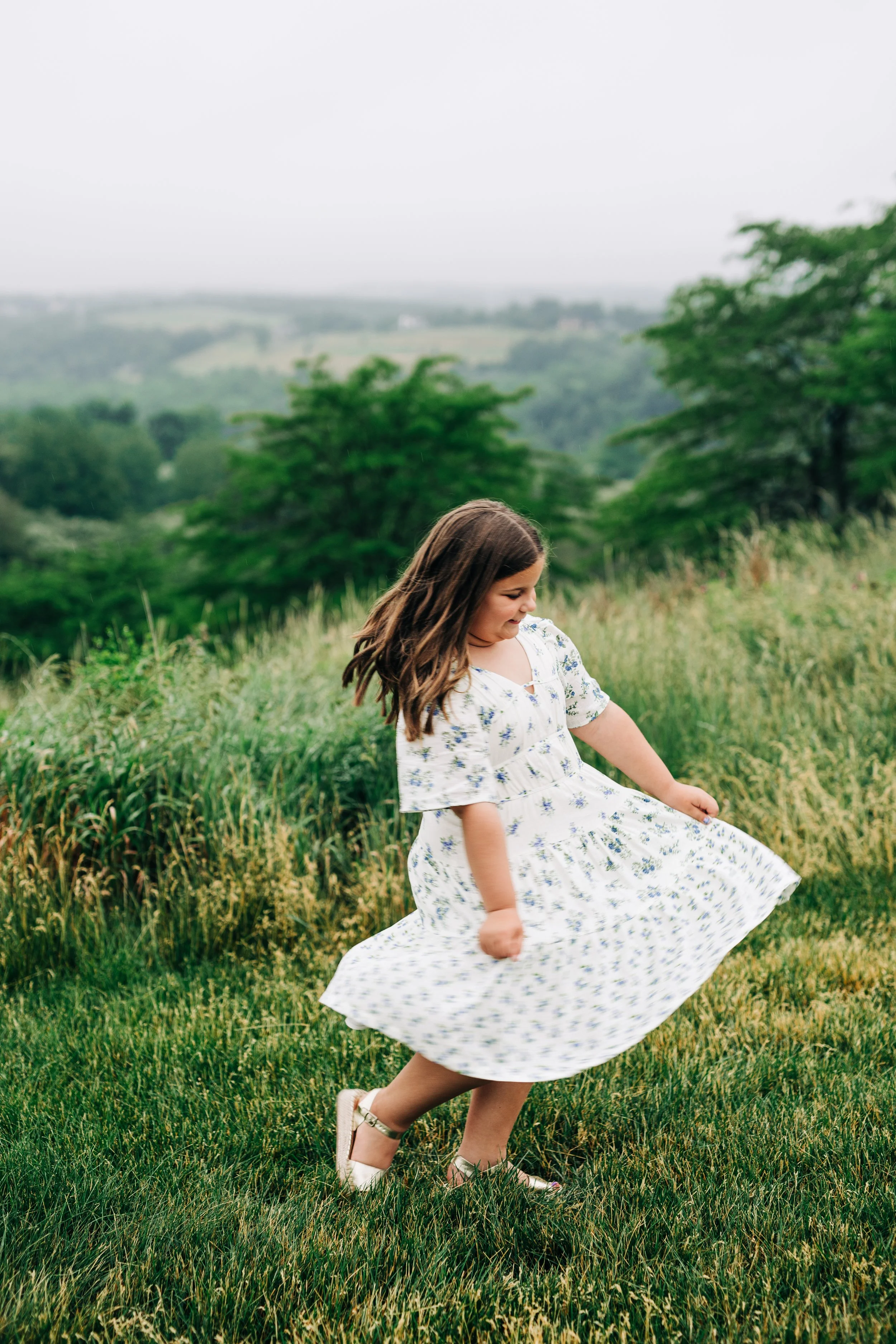 girl spinning in a dress at Trexler Nature Preserve