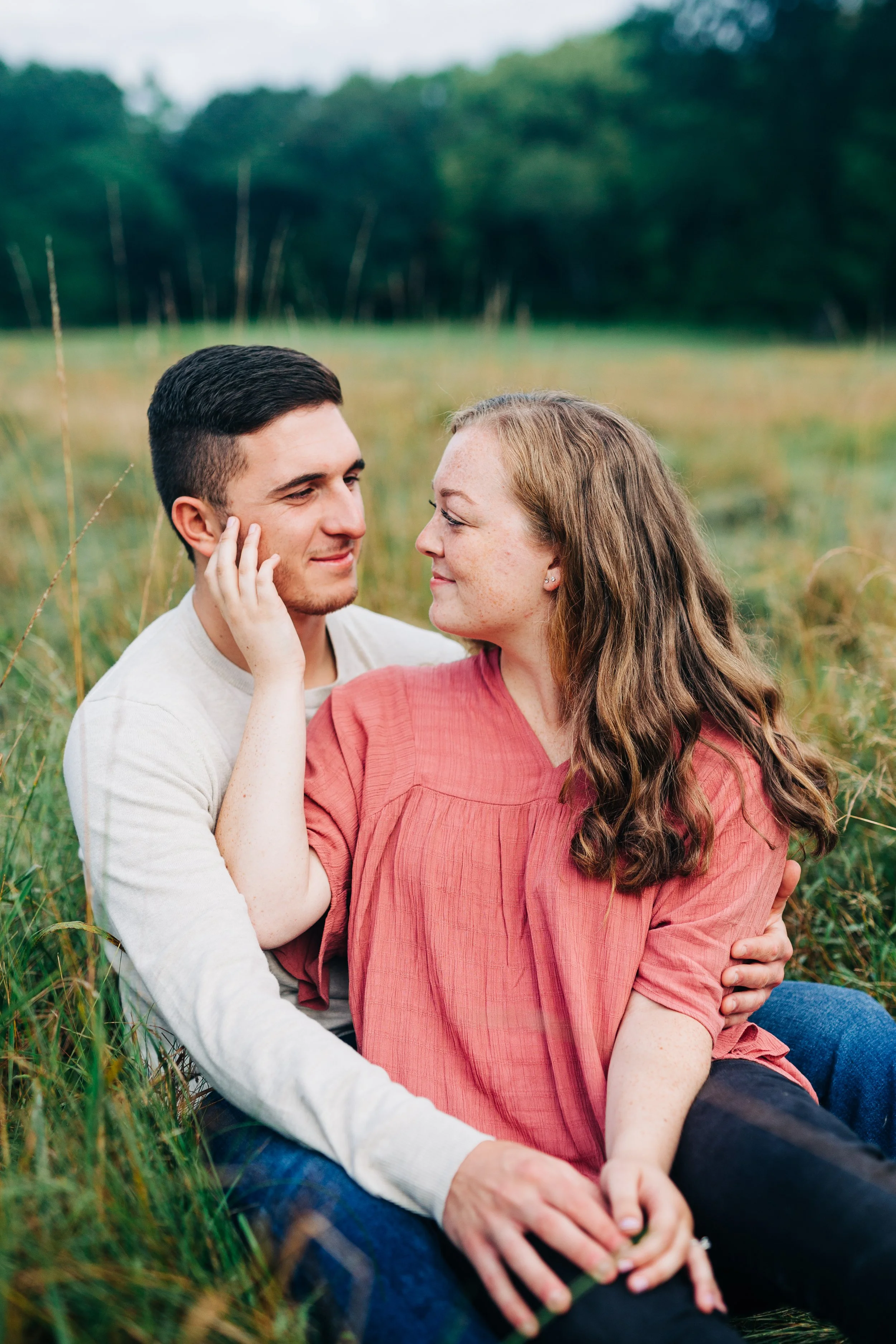 couple sitting in a field at Trexler Memorial Park
