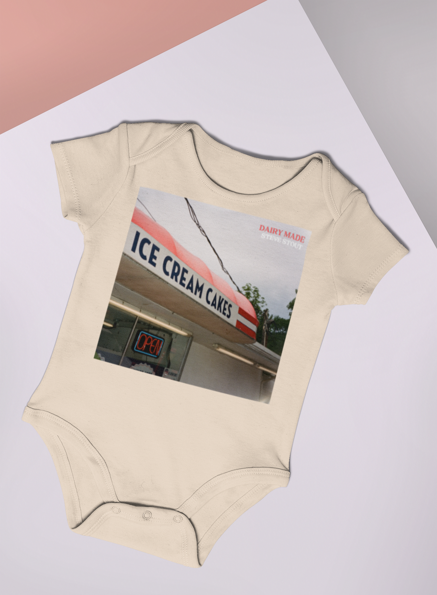 mockup-of-a-baby-onesie-lying-in-a-colored-setting-25177.png