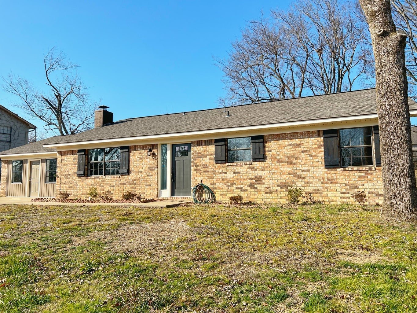 Discover  1918 University Drive! 
This beautifully remodeled Russellville home has been fully updated from floor to ceiling, it feels like a brand-new dwelling!
The heart of the home is an open living, kitchen, and dining area featuring chic granite 