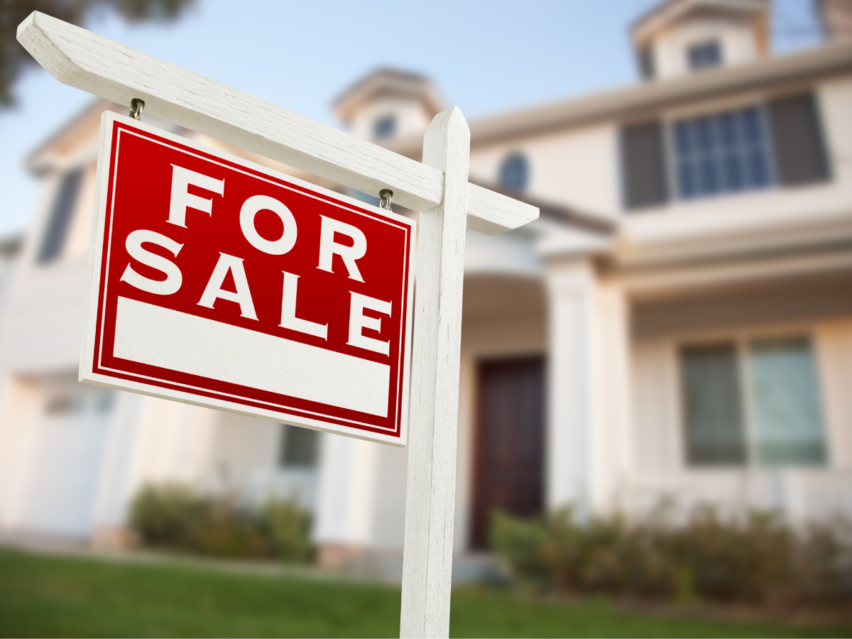 King County residential neighborhood with a for-sale sign indicating market activity.