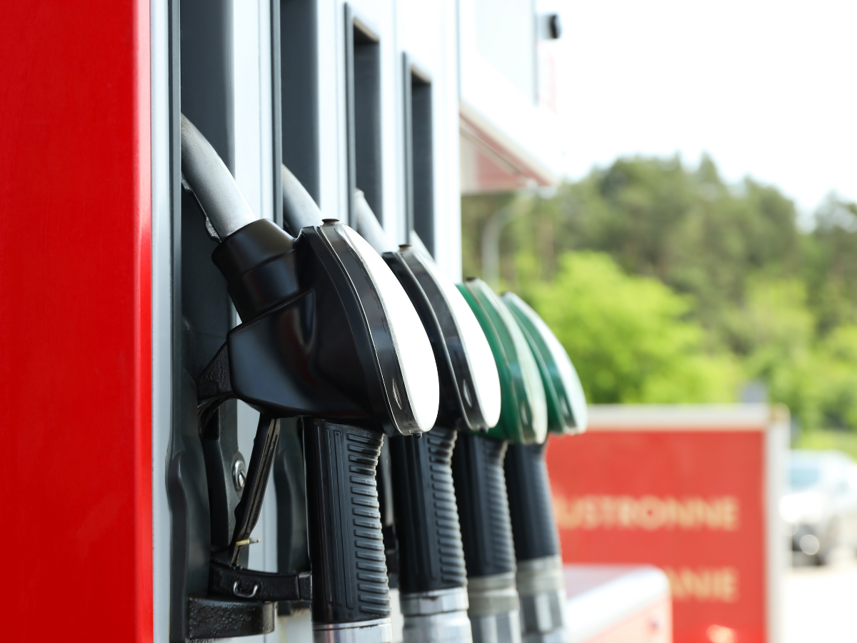 Driver fueling up in King County, Washington as gas prices rise in spring 2026.