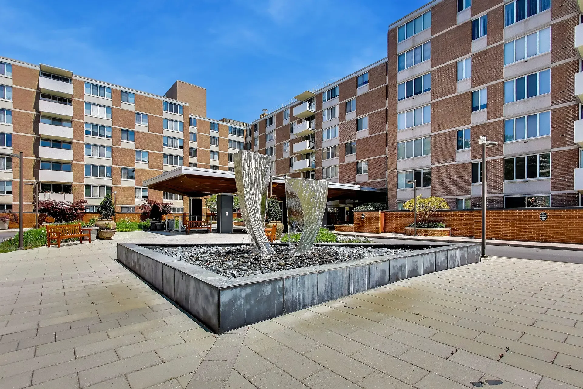 2939-van-ness-st-nw-unit-621-washington-dc-08-building-front-fountain.webp