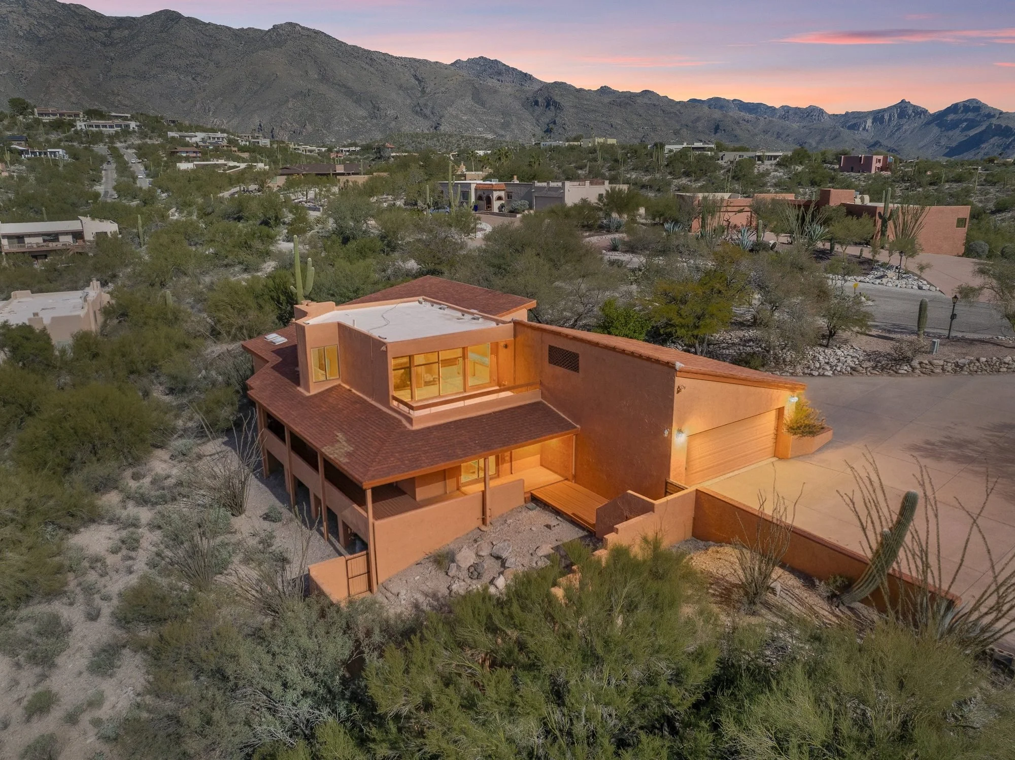 Luxury home at 5776 Paseo Cimarron in the Catalina Foothills of Tucson, AZ at twilight, sold by Oliver Realty