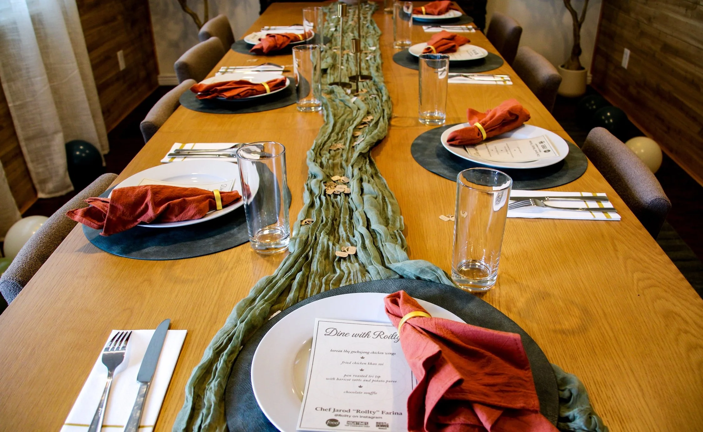 Elegant private chef table setup for a bachelor party dinner in Denver with custom menus and fine dining place settings.