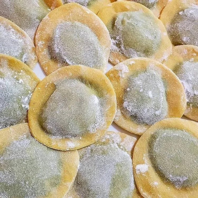 Handmade ravioli dusted with flour before cooking