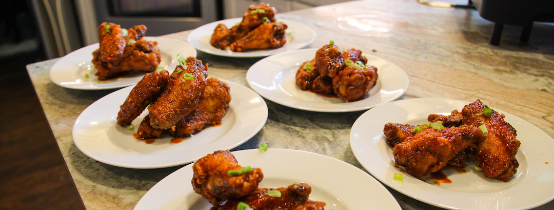 Korean gochujang chicken wings served during a Denver bachelor party private chef dinner by Chef Roilty.