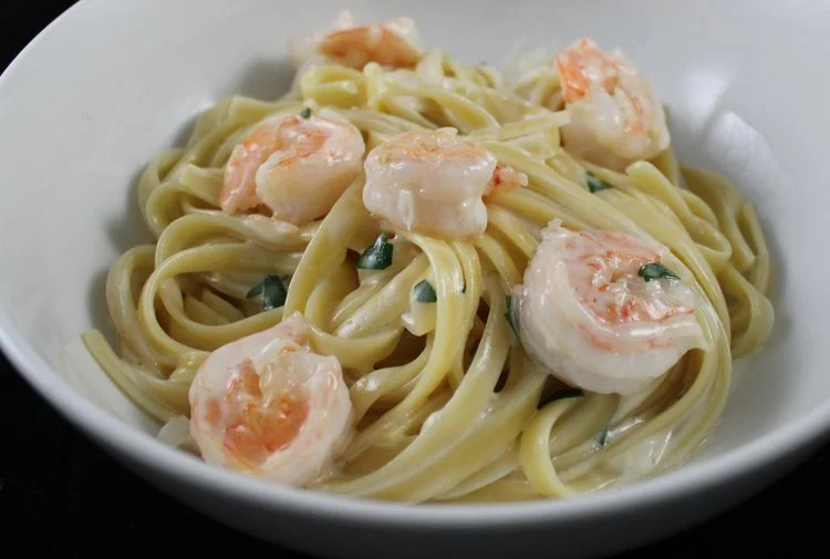 Shrimp Alfredo with long pasta noodles in a creamy sauce