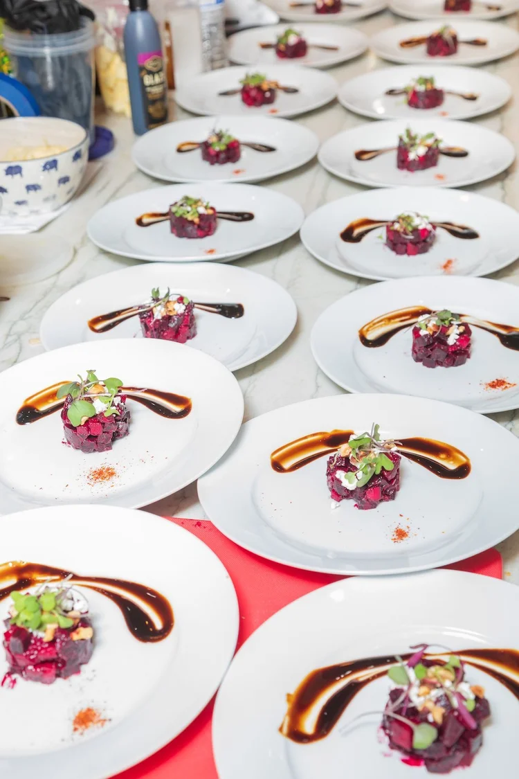 Beet salads plated on white dishes for a private dinner