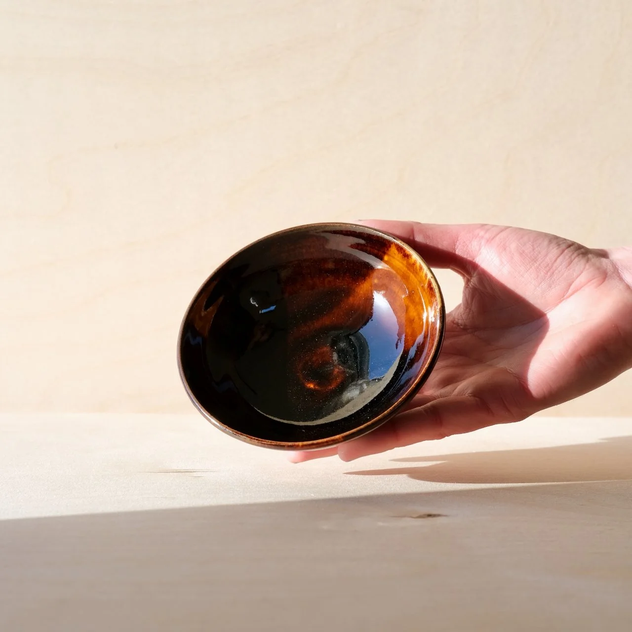 light through dark water shallow dish