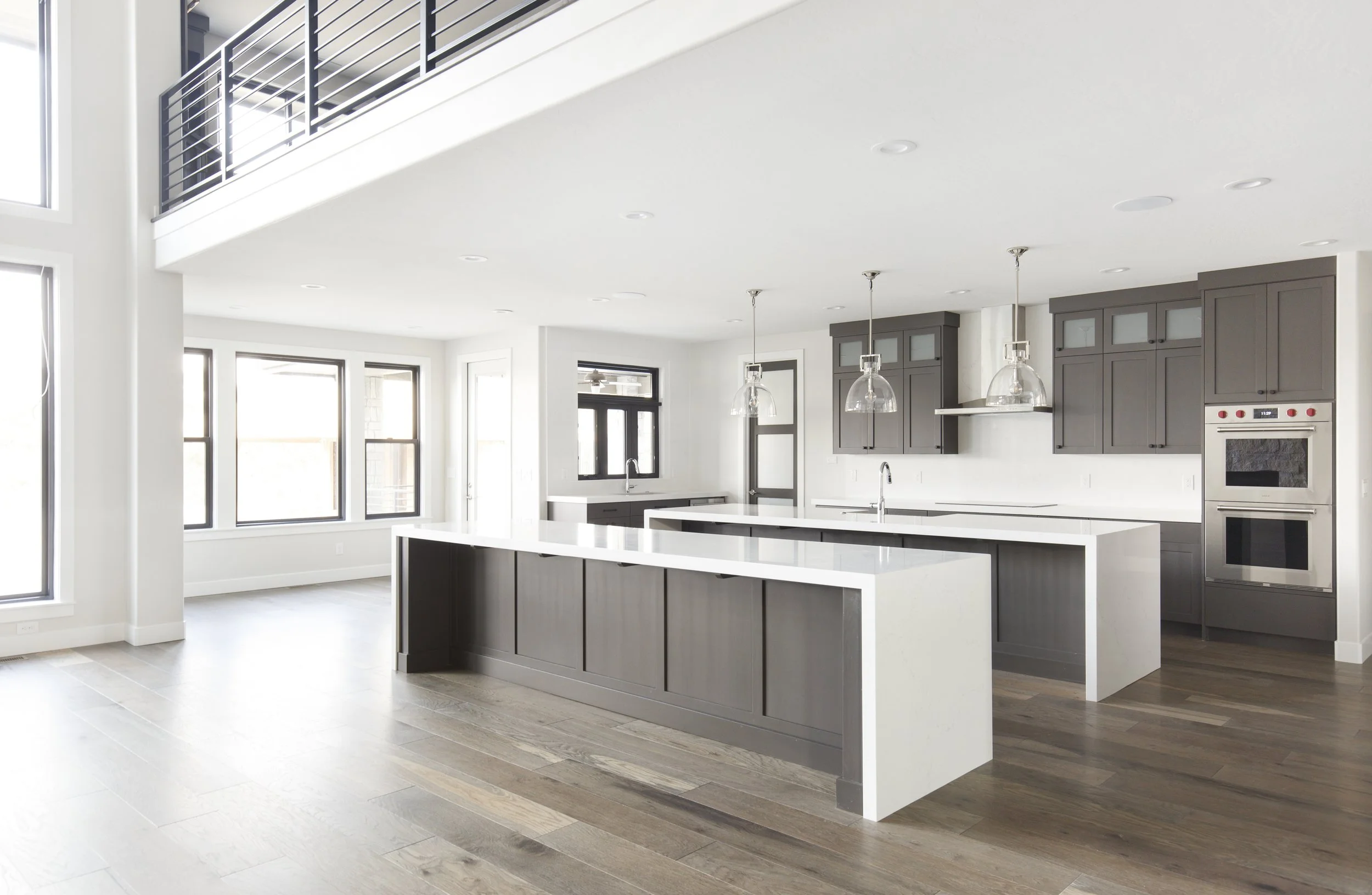 RME011_Madrigal_Prarie_PreSold_INT_Kitchen-Dining Nook_Double Island-Lighitng-Countertop-Lighting.JPG