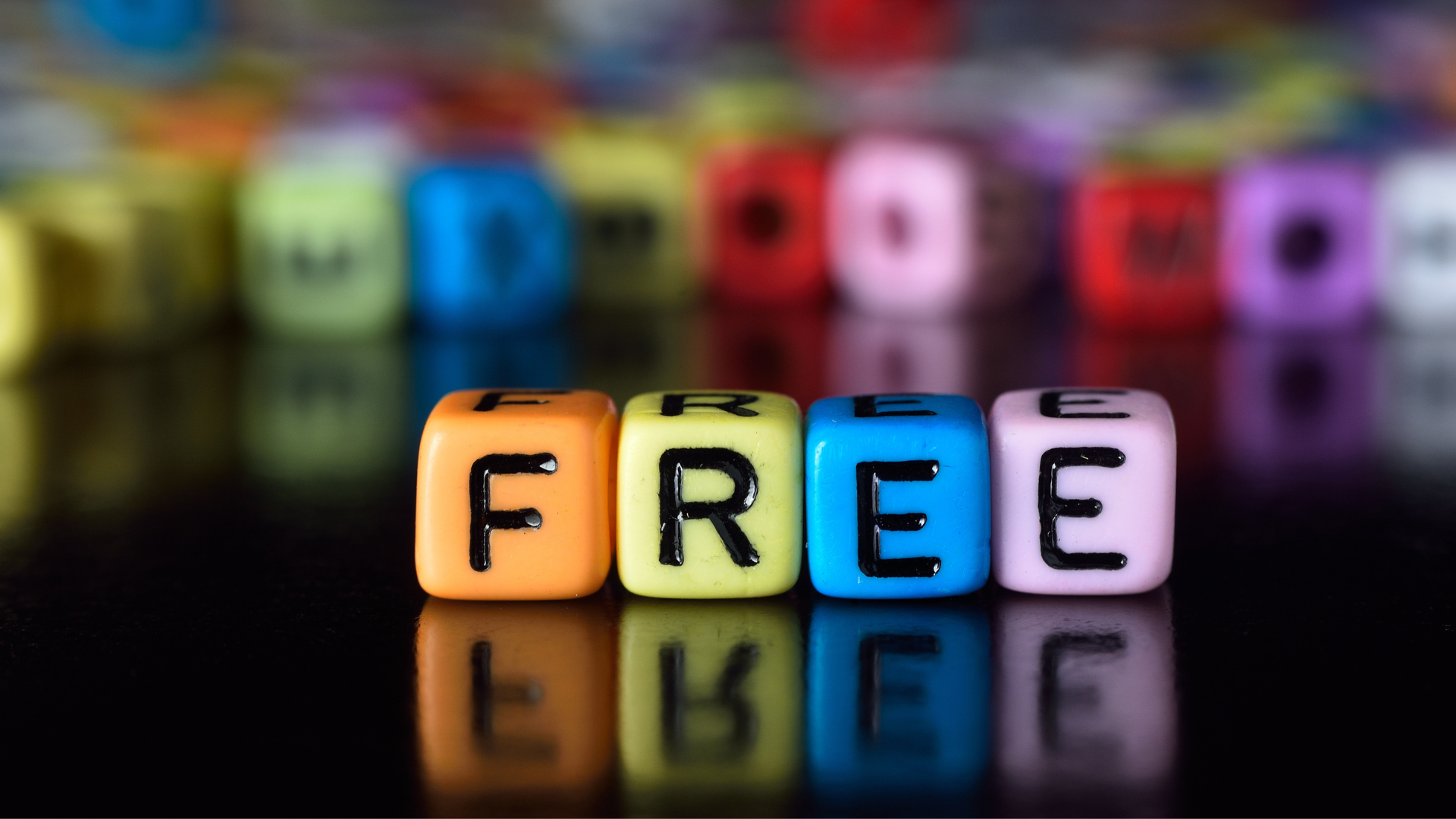 Colorful letter blocks spelling “FREE,” representing free tools available to nonprofit organizations.