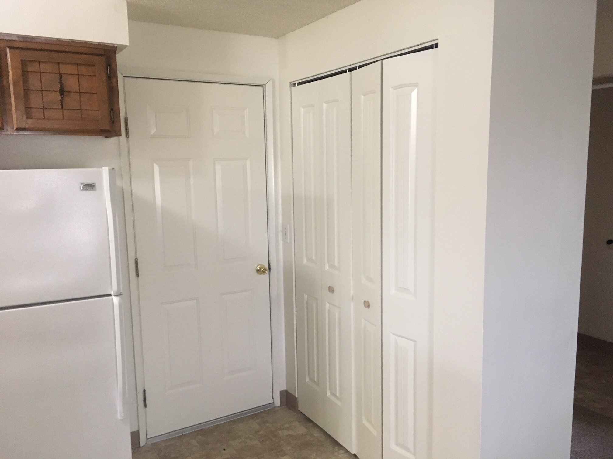 4197 Penticton kitchen, pantry, garage door.JPG