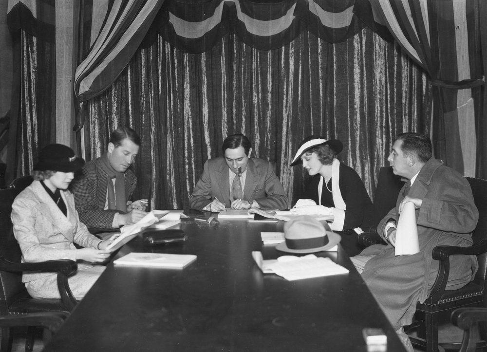 Merkel, Chevalier, Lubitsch, Macdonald, and Horton at a script reading.