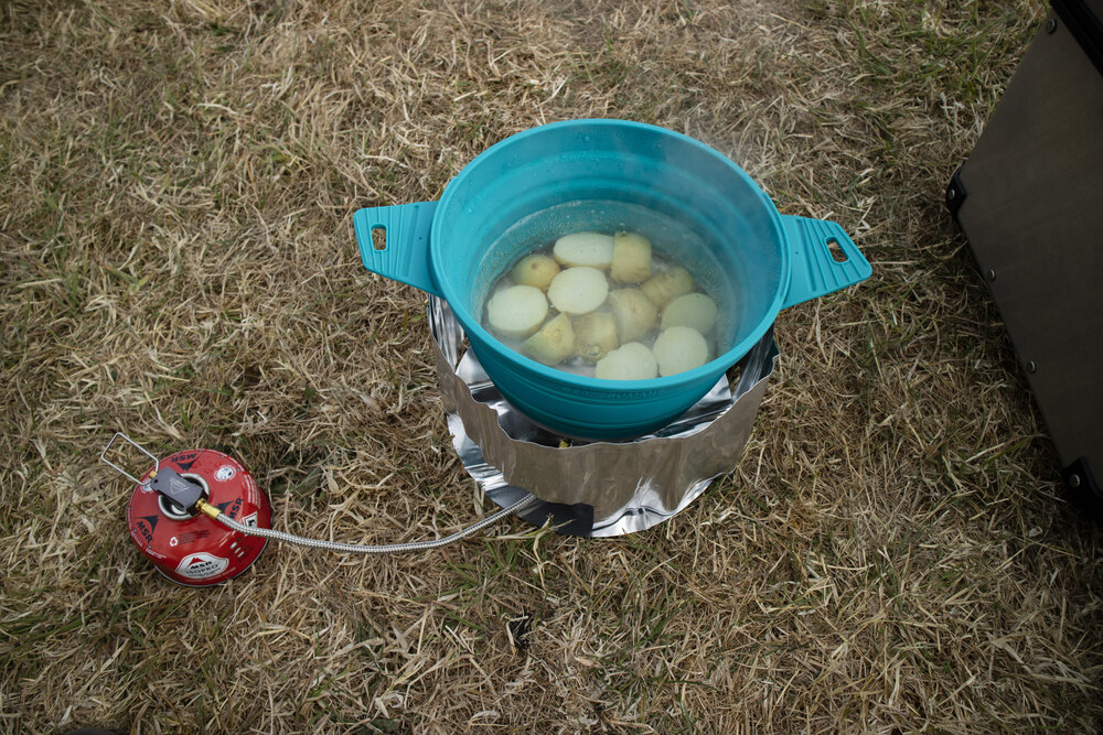 Ride the miles Croyde camping stove cooking potatoes.jpg