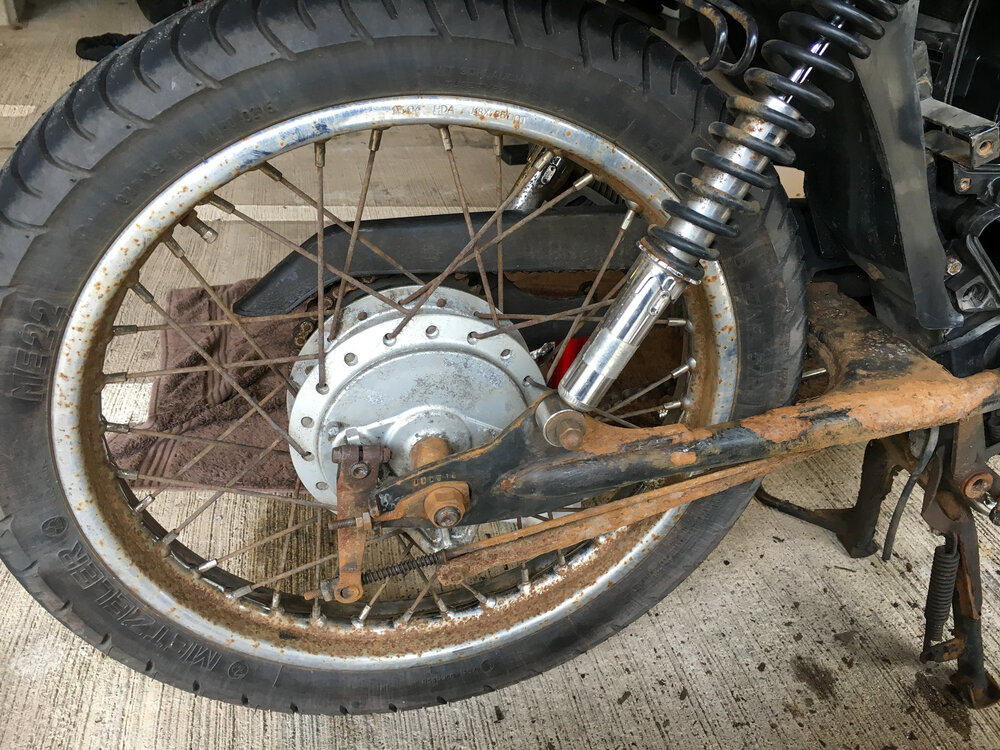 Ride the miles Honda CG125 Red restore rusty wheel and swingarm.jpg