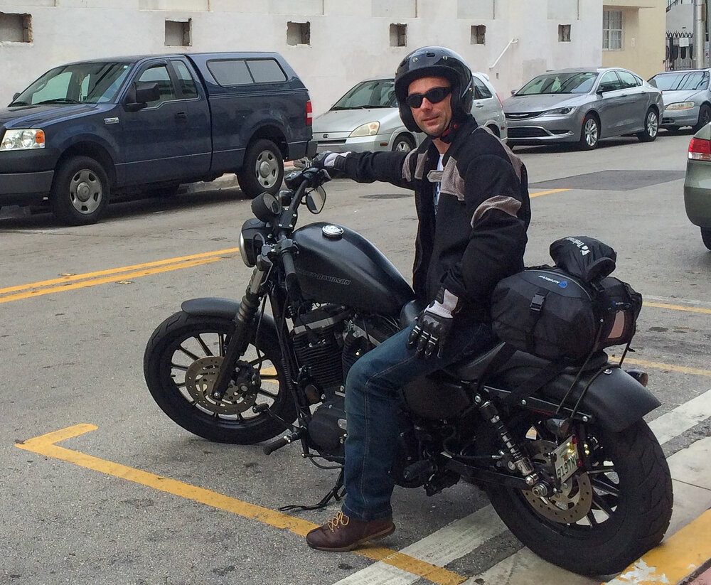 Trev on a Harley Davidson 883 Iron touring Florida with a tail bag