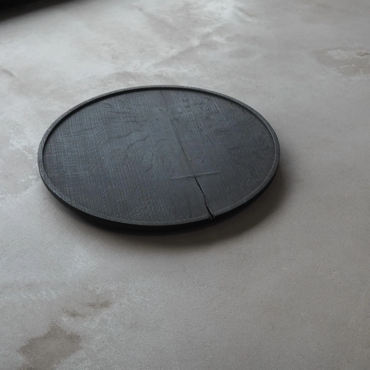 Circular Burnt Oak Tray from our Winter Collection.
Large sculptural piece with a beautiful tactile surface from the burning process, with subtle decorative splits and scars, and stunning medullary rays.

Available from our online shop.