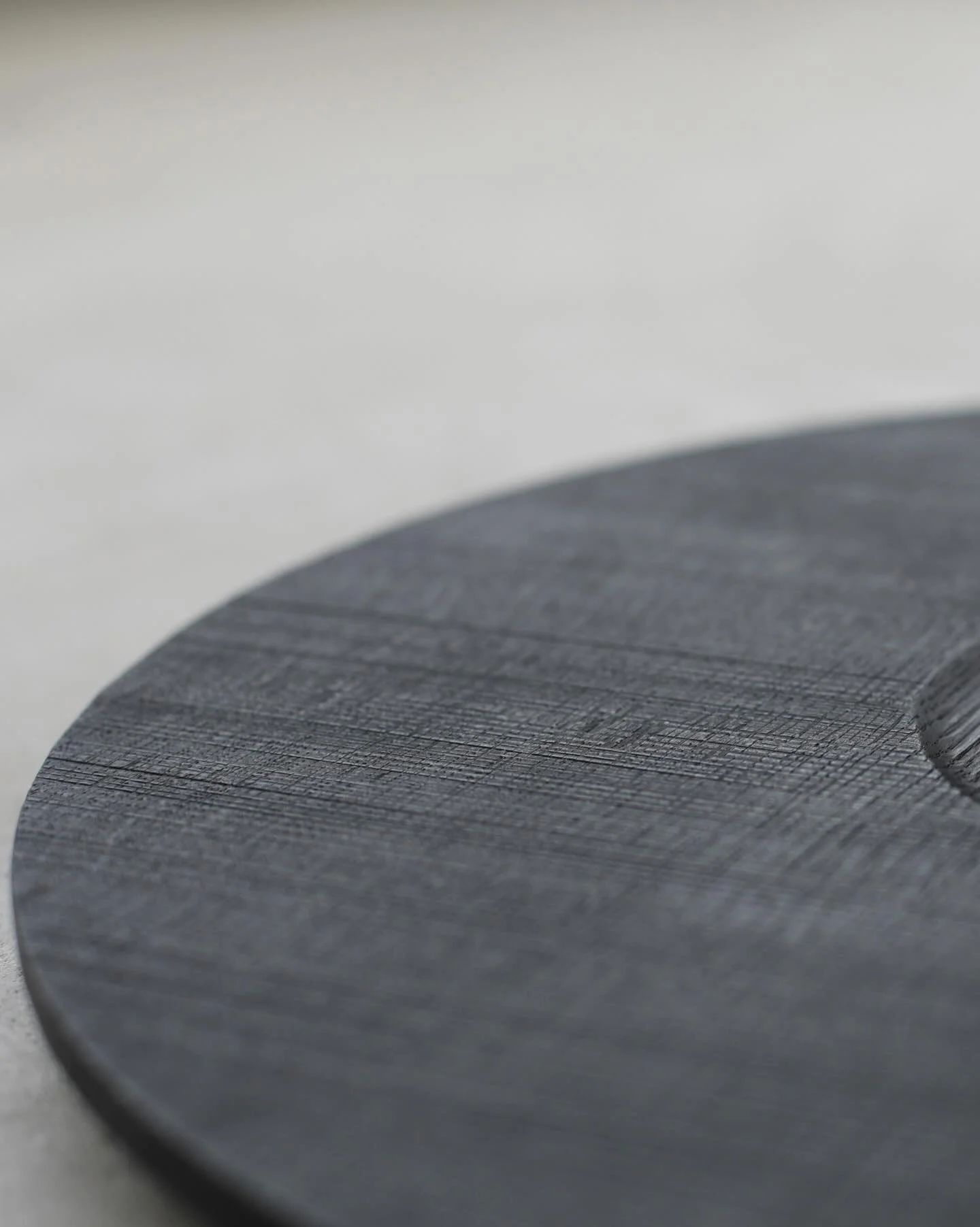 Sawn texture on our Burnt Oak Inner Circle Tray.
The process to achieve this is slow but mediative, creating a subtle but tactile surface texture. Contrasted in this piece with a smooth gently recessed inner circle.

We designed and made this large s
