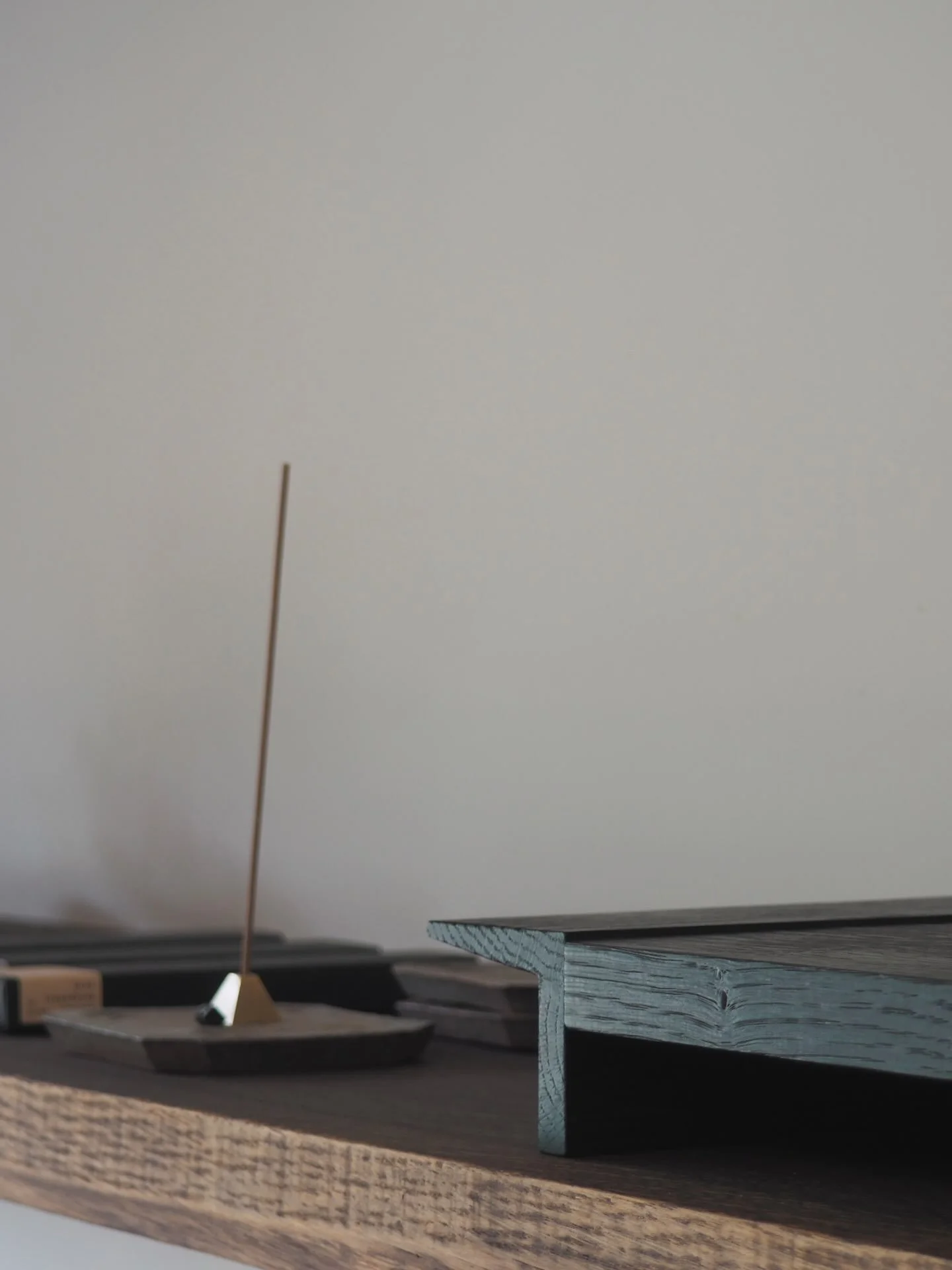 Little details from our group exhibition Tea + Clouds, currently showing at our gallery @flowerbird.windmoon 
Info for each image in multiple captions.

Low Tea Tray with handles, in Burnt English Oak by @pachadesignuk 
Incense and brass pyramid hold