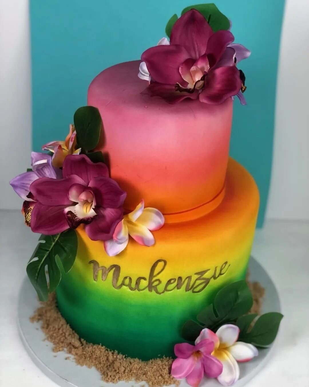 This bright Pina Colada cake  paired with sweet Sugar cookies makes me think of relaxing in a hammock somewhere on a beautiful tropical island with my toes sunk deep beneath the sand.  The pop of color and flower accents blend beautifully together. I